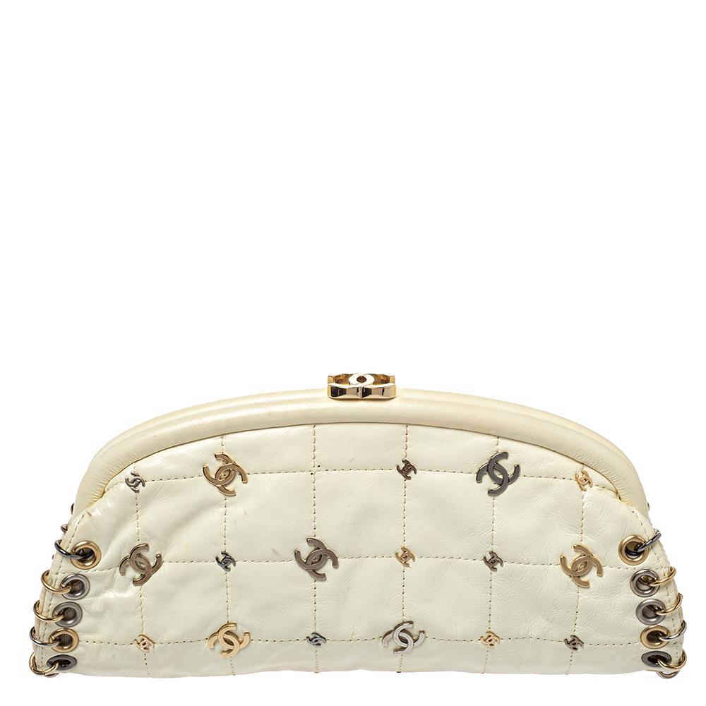 A stylish clutch is a closet staple for all fashionistas! This CC Punk Timeless clutch from the house of Chanel is crafted from cream leather and covered in quilting and CC logos. The piece is equipped with a CC lock which reveals a well-sized