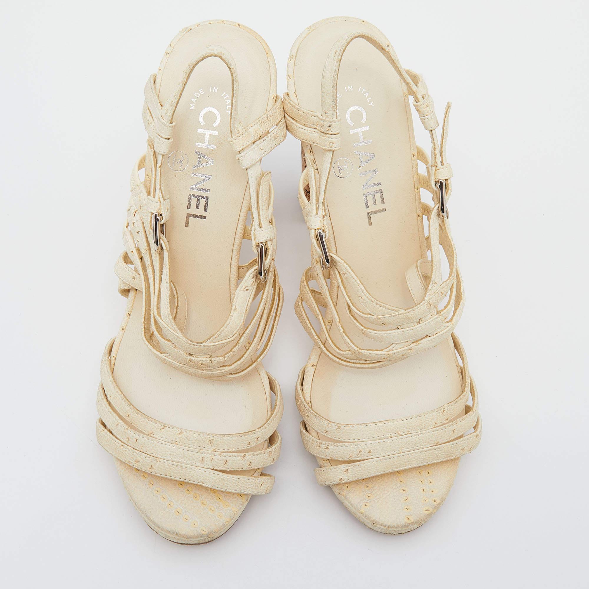 One of the most celebrated fashion House, Chanel is known for its brilliant craftsmanship in shoemaking. Crafted from leather in a cream shade, the strappy style will adorn your feet in the most beautiful way.

Includes: Original Dustbag
