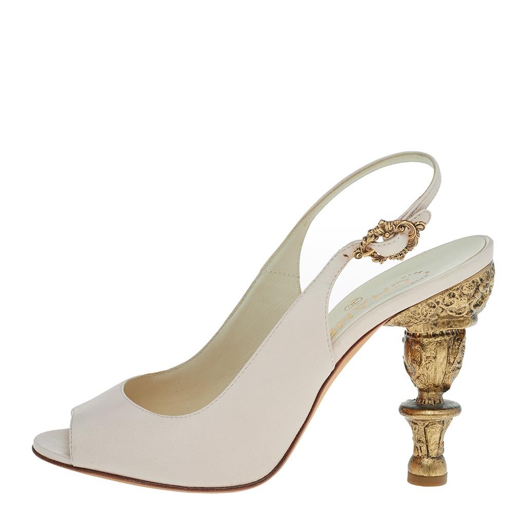 Combining comfort with elegance, these Chanel slingback sandals are a wardrobe essential. Crafted in cream leather, the sandals feature an open-toe design. The sandals have well-carved gold-tone heels. These elegant sandals can be worn with any