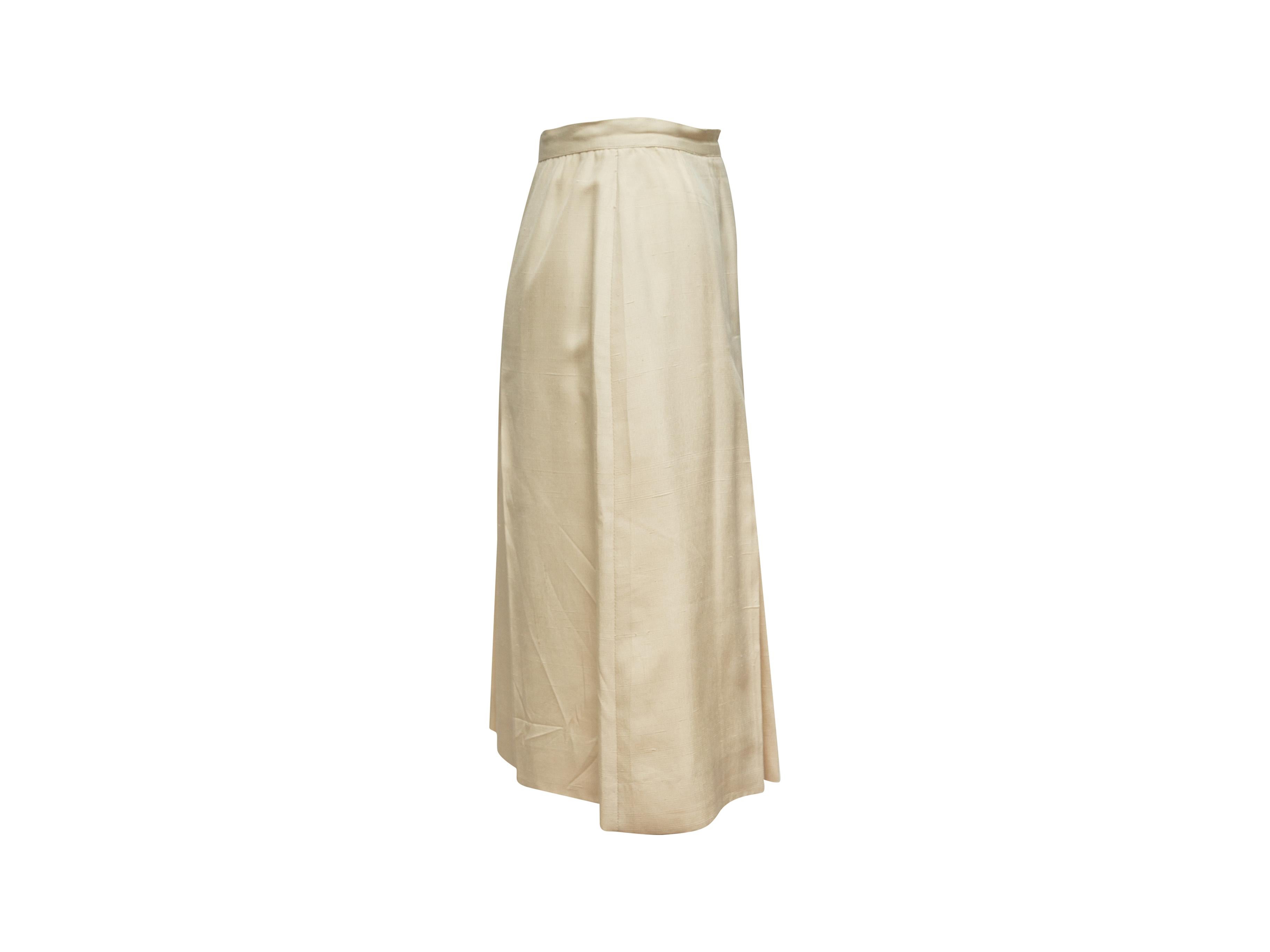 Product details: Vintage cream pleated skirt by Chanel. Concealed closures at side. Designer size 38. 29