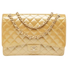 Chanel Cremefarbene Maxi Classic Single Flap Tasche aus gestepptem Lackleder