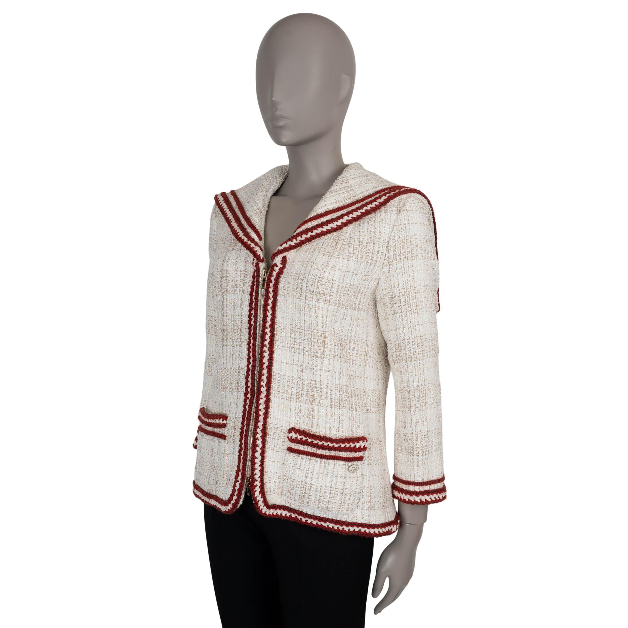 This 100% authentic Chanel jacket in cream and beige tweed offers a nautical-inspired twist on classic sophistication. Crafted from a luxurious blend of cotton (33%), acetate (27%), polyamide (23%), and polyester (17%), it features a stylish sailor