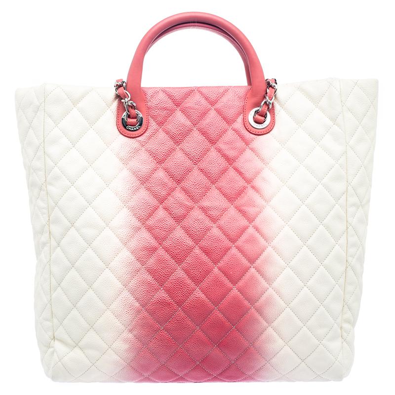 Featuring top handles with a shoulder chain link and a cream-rose ombre quilted exterior, this Chanel shopping tote bag exudes just the right amount of sophistication. The bag features an open top, with a capacious compartment to house all your
