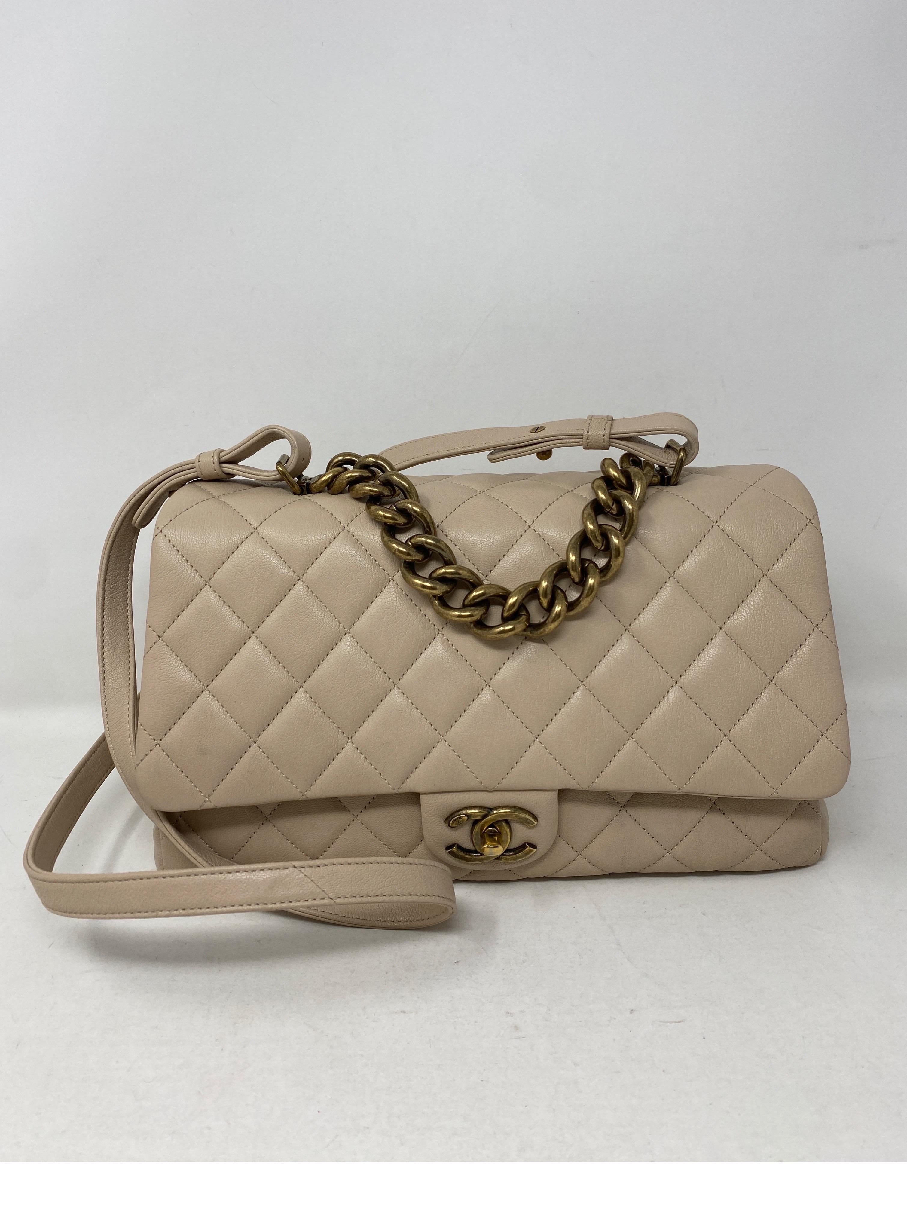 Chanel Cream Leather Trapezio Bag. Antique gold hardware. Cream leather bag. Can be worn crossbody. Excellent like new condition. Inside has three compartments. 12