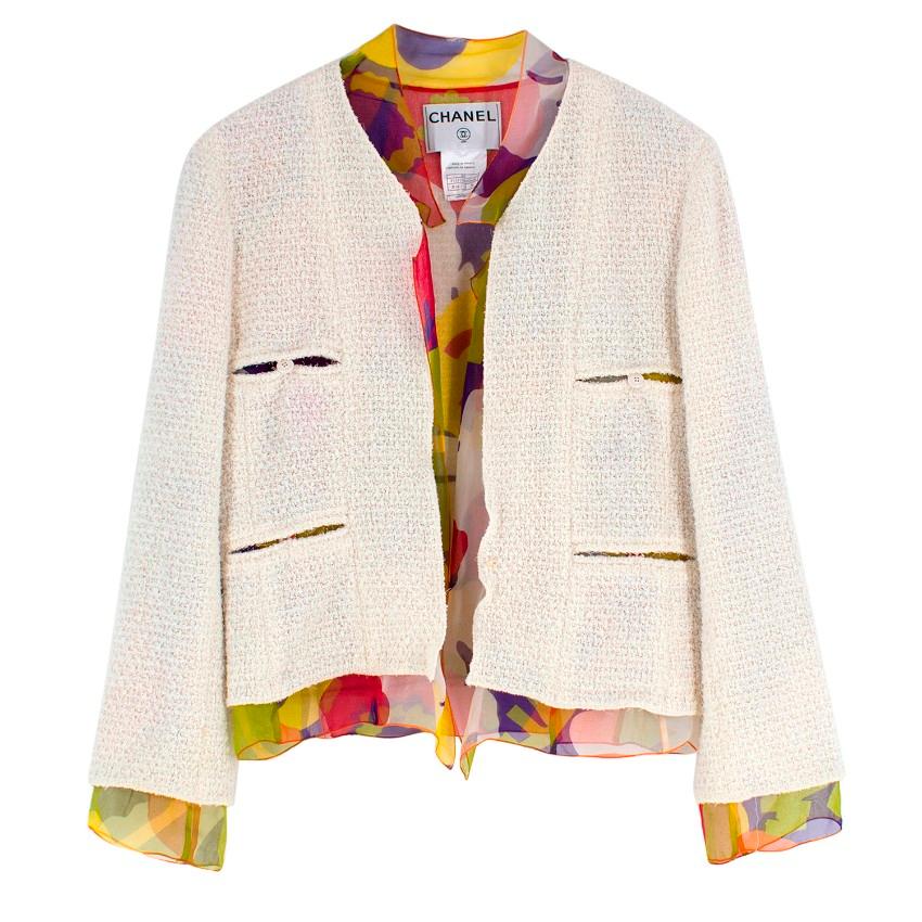 Chanel Cream Tweed Jacket with Silk Lining

-Cream jacket with multicoloured silk lining
-Four front pockets with button closure
-Buttons embossed with Chanel
-Lining is shown at the cuffs, collar, hemline, pockets and centre line
-Chanel embossed