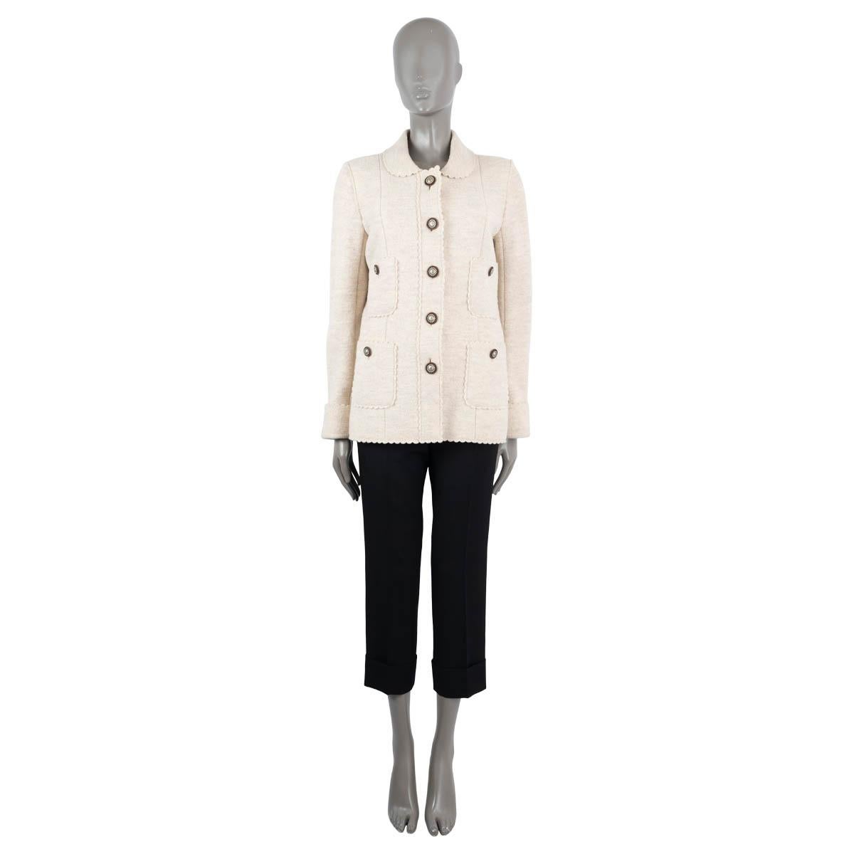 100% authentic Chanel jacket in cream wool (100%). Featuring four patch pockets on the front, a peter pan collar and scalloped edges. Closes with buttons on the front and is lined in silk (100%). Has been worn and is in excellent condition.

2014