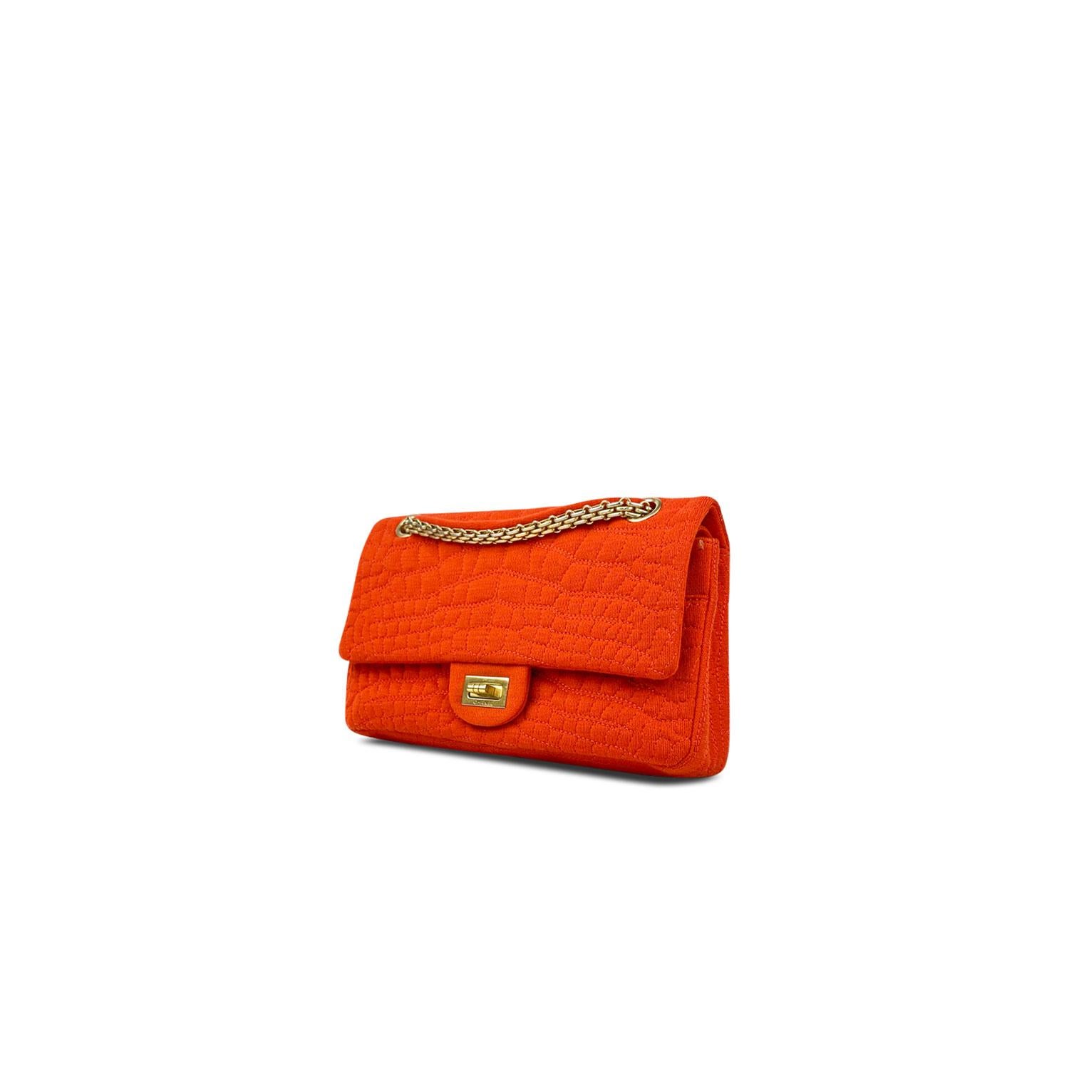 Orange jersey Chanel Croc Reissue 225 Double Flap Bag with

- Antiqued gold-tone hardware
- Convertible chain-link
- Exterior pocket at back
- Tonal grosgrain lining
- Four pockets at interior walls and Mademoiselle turn-lock closure at front