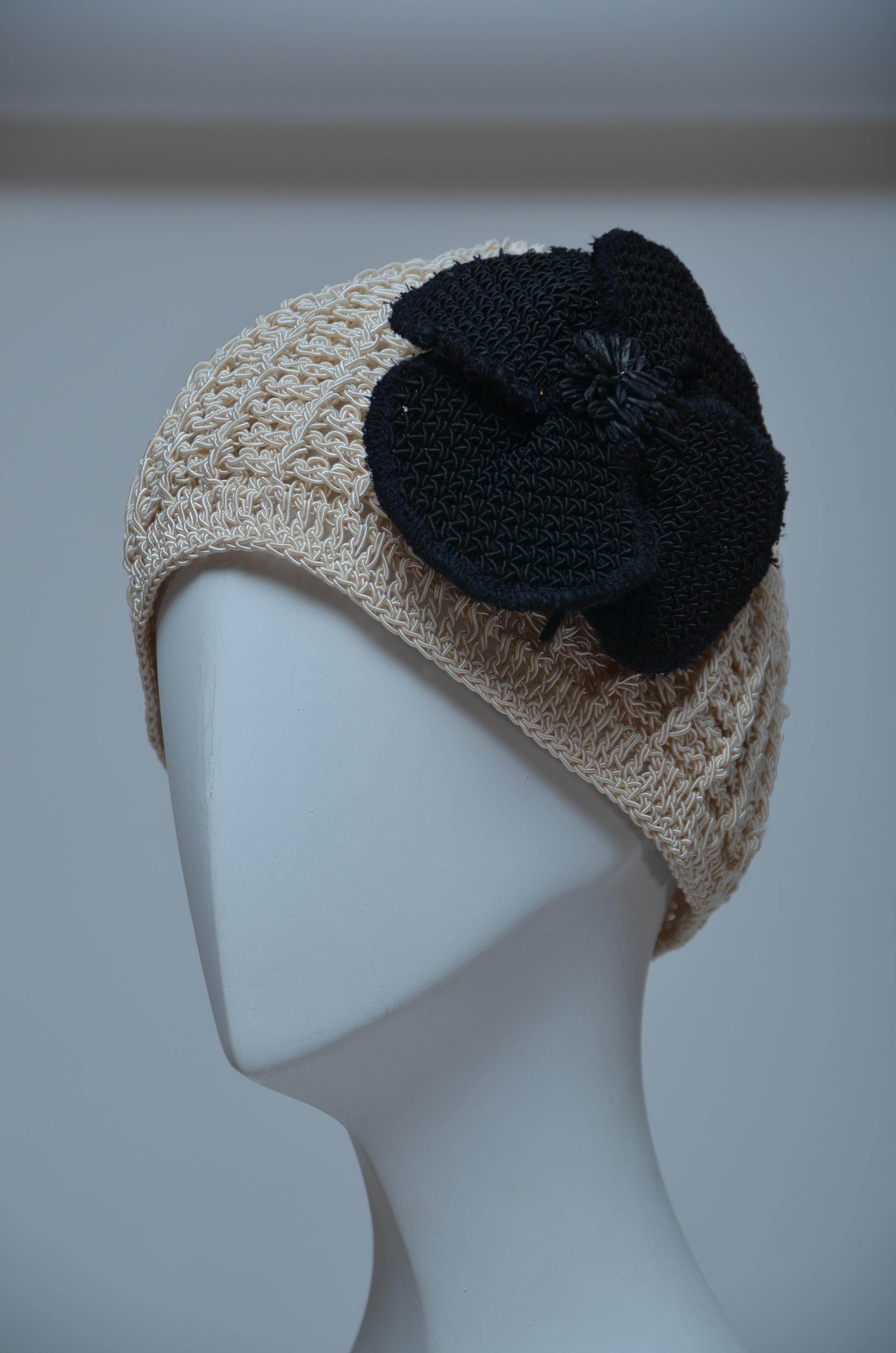 CHANEL
Crochet Camellia Beanie.
Very rare and impossible to find.
Excellent condition Looks unworn.
Large crochet black camellia can be removed 

FINAL SALE.