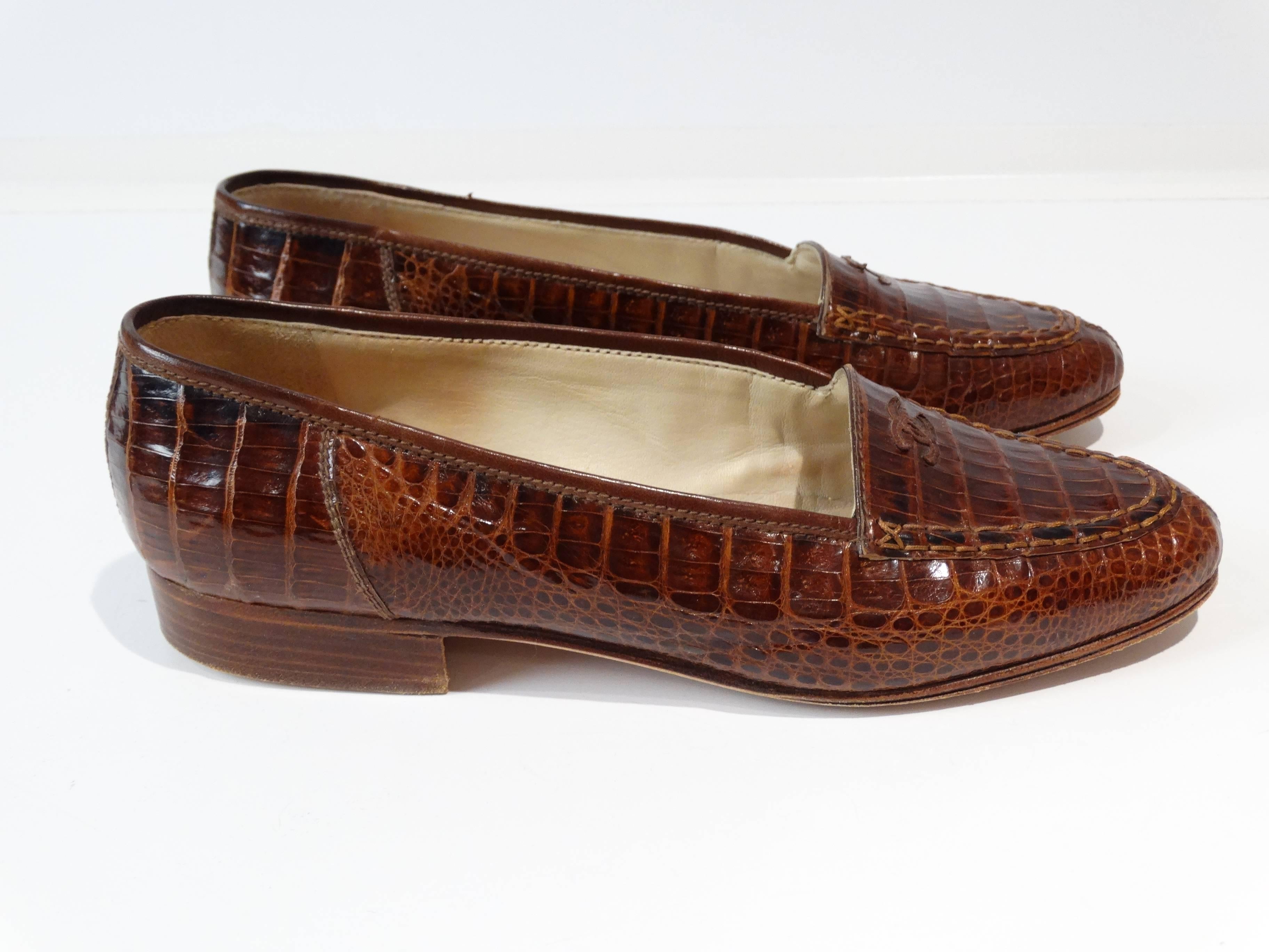 A beautiful pair of 1980s Chanel Crocodile slip on loafers in a deep coniac color. These lovelies have medium CC on the top front. Very little wear, marked a size 38. Only one previous owner a must have for any lover of exotics shoes. Made in France 