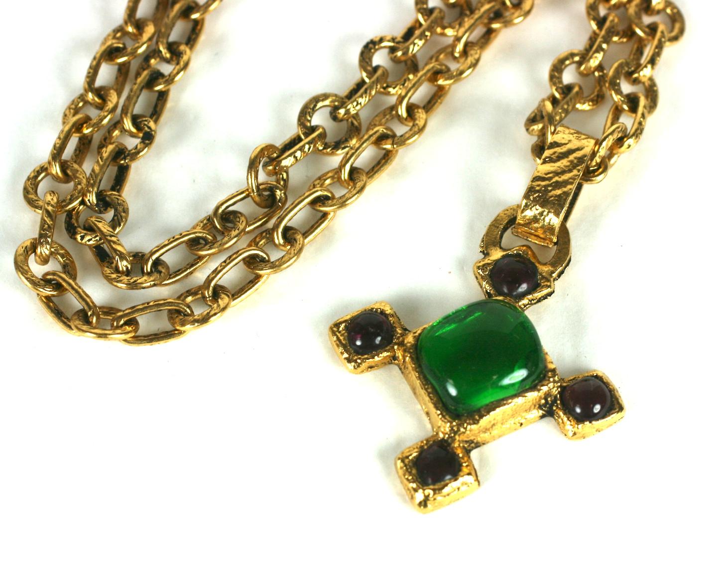 Chanel Cross Pendant in gilt bronze with amythest and emerald poured glass. Ornate gilt bronze link chain with hook closure. 
Chain 32