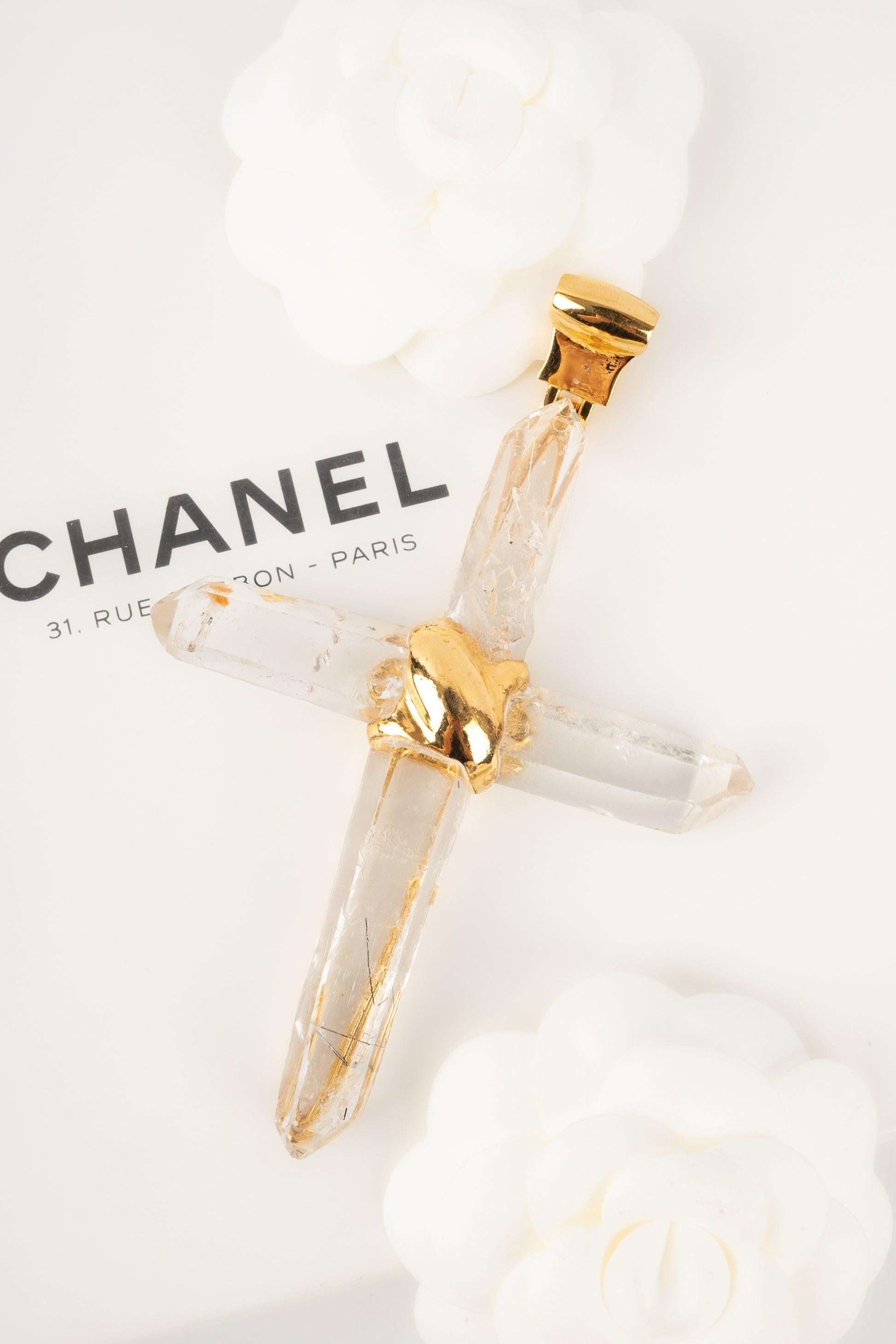 Chanel - Not signed yellow gold crosse pendant with rock crystal. Chanel creation designed by Robert Goossens in the 1960s. Jewelry seen at the 
