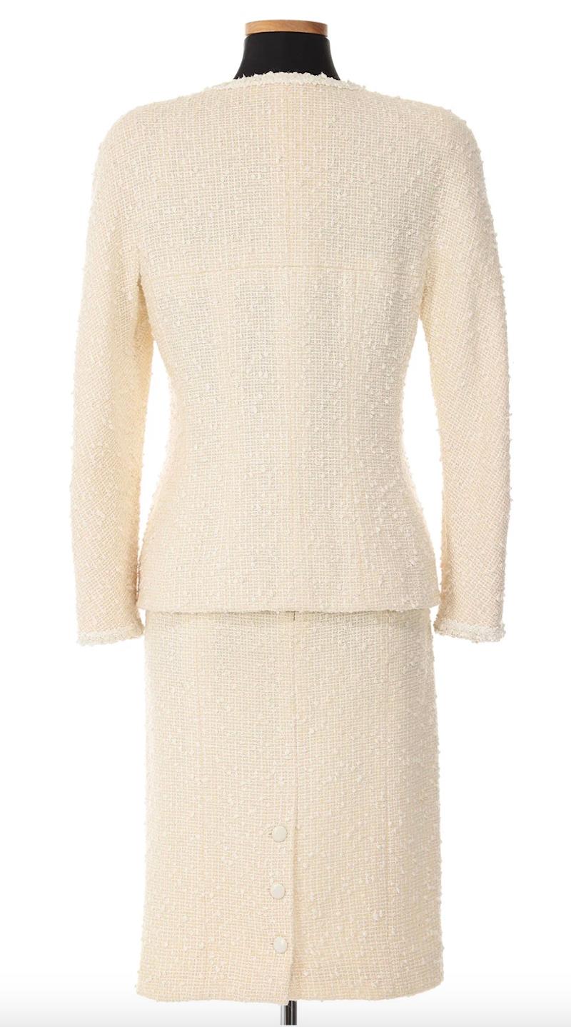 Chanel Cruise 1996 White Tweed Skirt Suit. A sophisticated and timeless ensemble that exemplifies Chanel's classic style. Whether it's a bridal look or an elevated summer staple, this suit is versatile, refined and timeless. 

Jacket
Shoulders 18