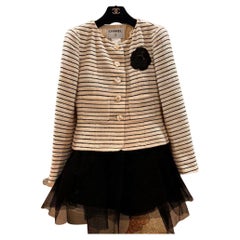 Chanel Cruise 2001 (01c) Beige Camellia Tweed Jacket and black skirt 2000 (00A)