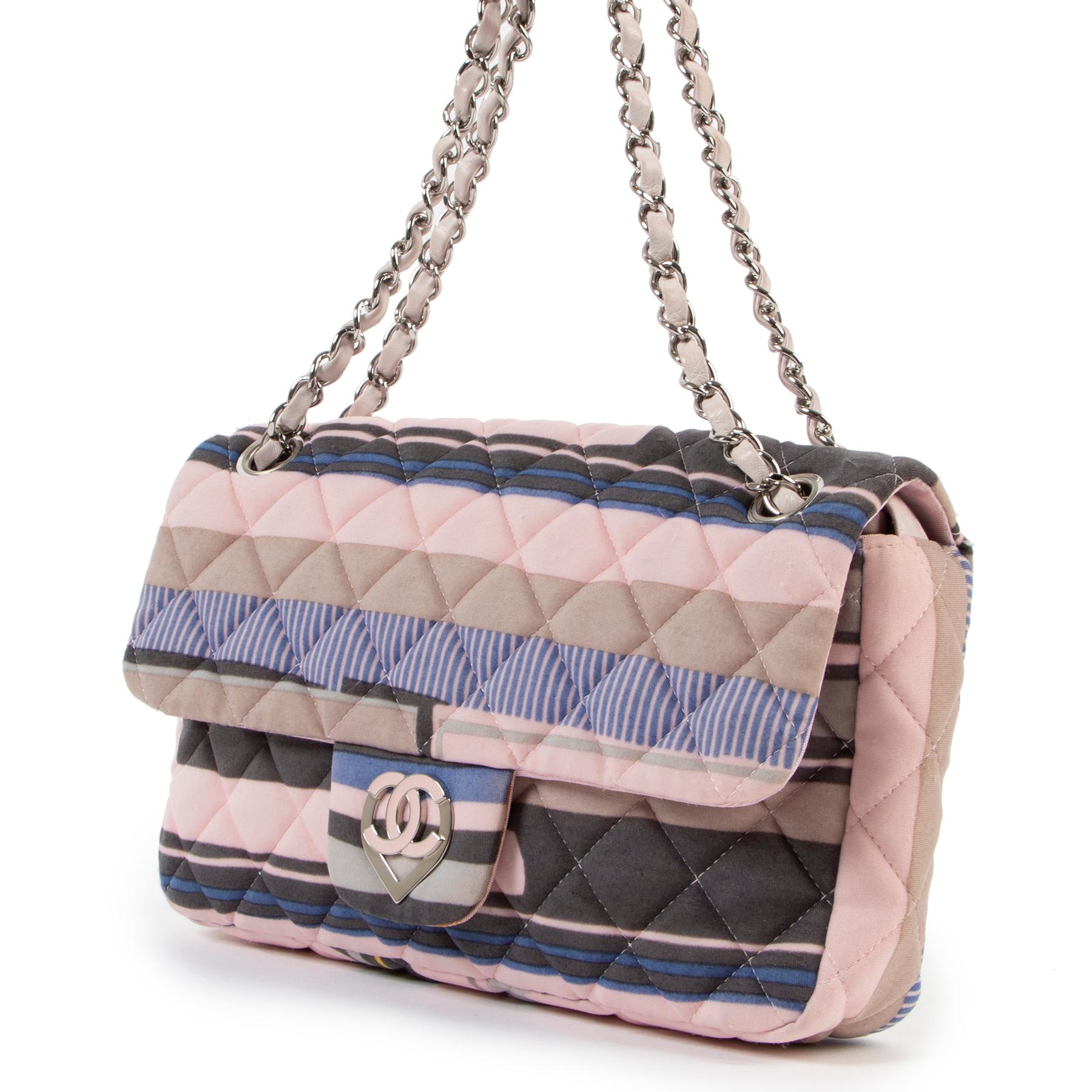 Chanel Cruise 2009 CC Heart Printed Jersey Medium Flap Bag

Fresh off the Chanel Cruise 2009 Runway, this iteration of the classic flap bag is funky and whimsical. Finished in a quilted, stretchy jersey and silver-tone hardware, the CC turnlock has