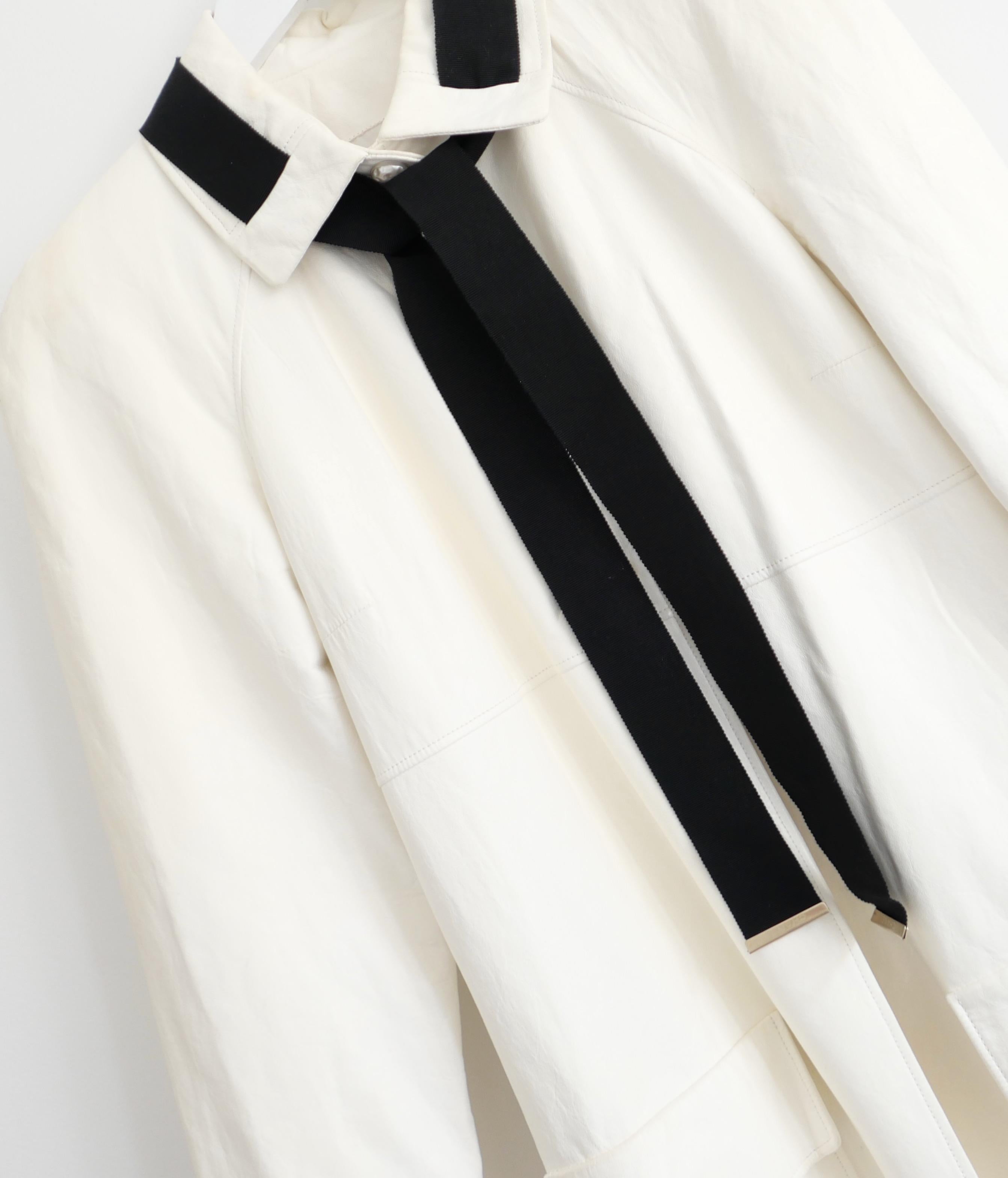Absolutely divine Chanel leather coat from the Cruise 2017 ‘Cuba’ collection. Made from the softest, buttery cream lambskin leather with pebbled faux pearl popper buttons to front and CHANEL tipped black grosgrain ribbon tie to neck (removable).