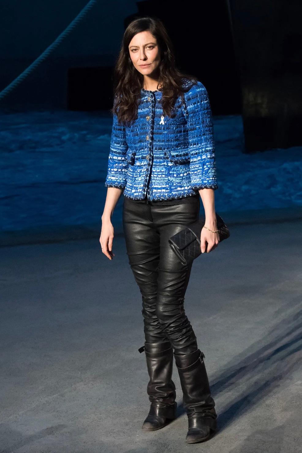 This exquisite jacket is part of Chanel’s Cruise 2018 collection, drawing inspiration from ancient Greece. The intricate craftsmanship is evident in the Lesage tweed, blending tulle and lace in multiple shades of blue and white, evoking the beauty