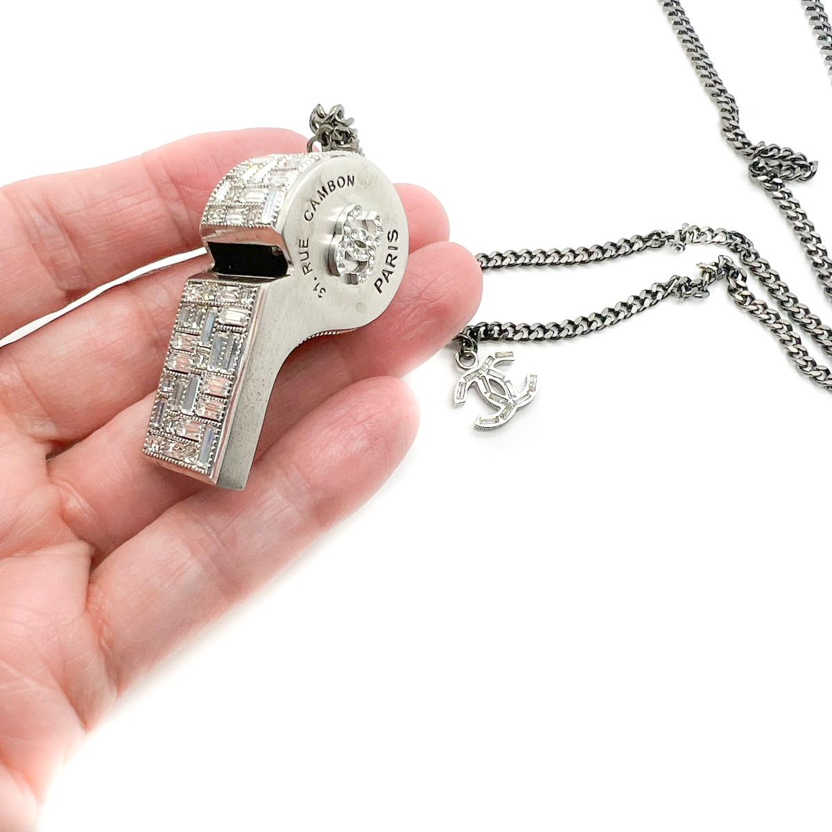 An extraordinary find, a Chanel Crystal Whistle Necklace. Dating to the 2015 collection the whistle is embellished with iconic codes of the House including the interlocking CC and the address of Coco's original Parisian store, 31-Rue-Cambon.
