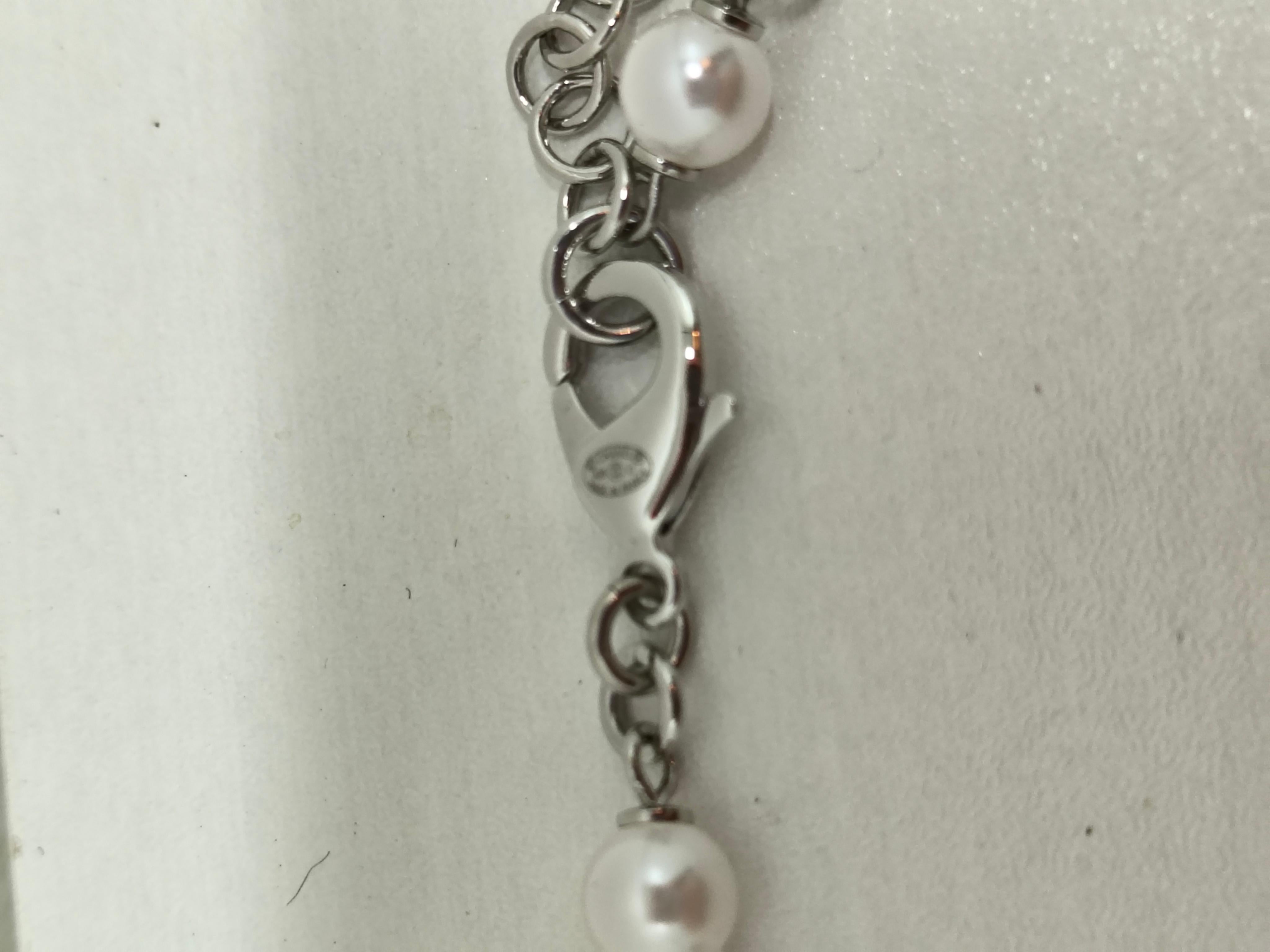 Exude timeless elegance with the Chanel Crystal Pearl Rhinestone CC Logo Long Necklace—a dazzling statement piece that captures the essence of Chanel’s iconic sophistication. This exquisite necklace features a harmonious blend of lustrous pearls,