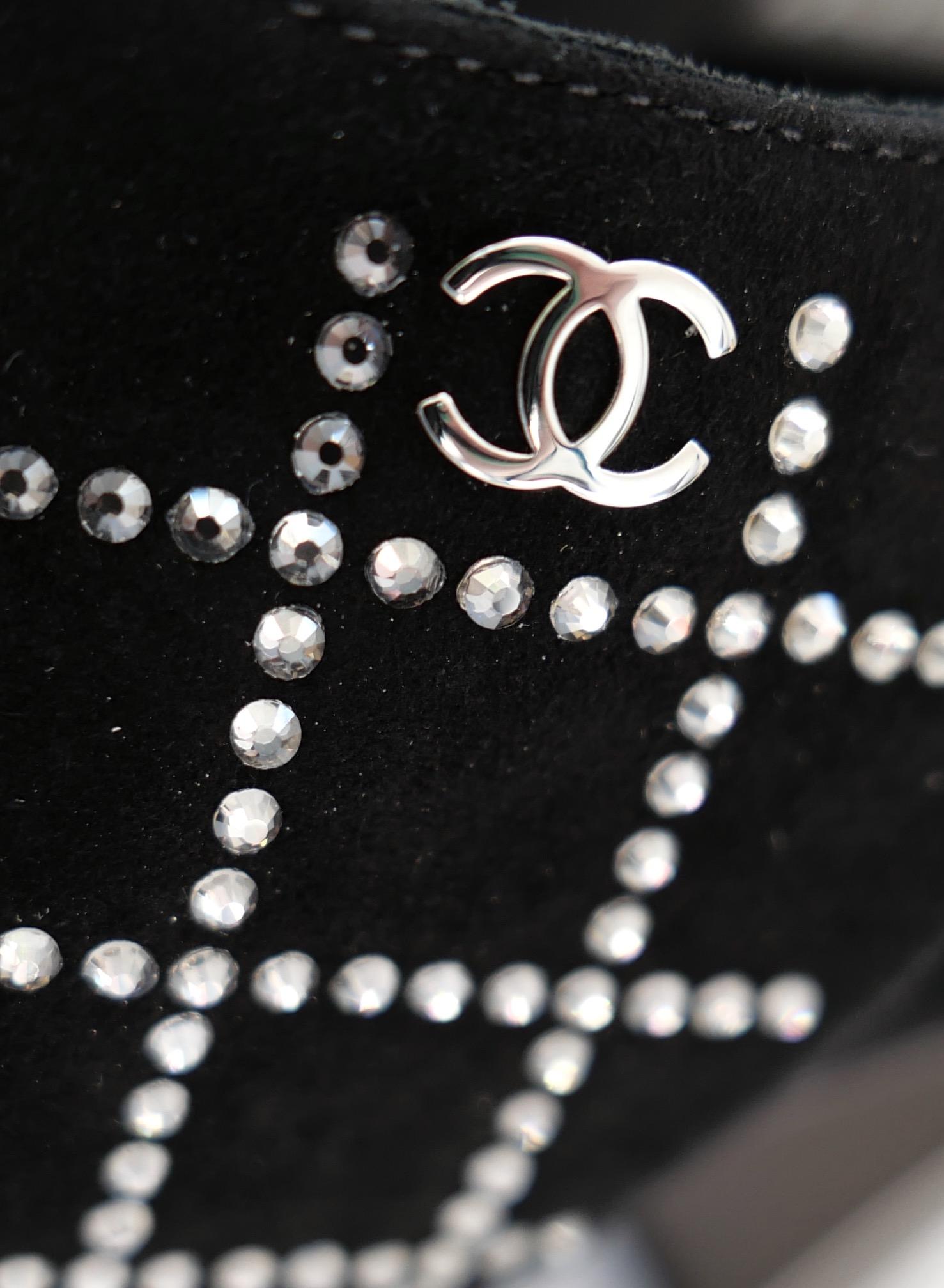 Absolutely stunning Chanel crystal peep toe heels. Unworn with dustbag. Made from soft black suede with a sparkling crystal grid embellishment. They have chunky silver heels which still have protective coverings intact, buckle up sling backs and CC