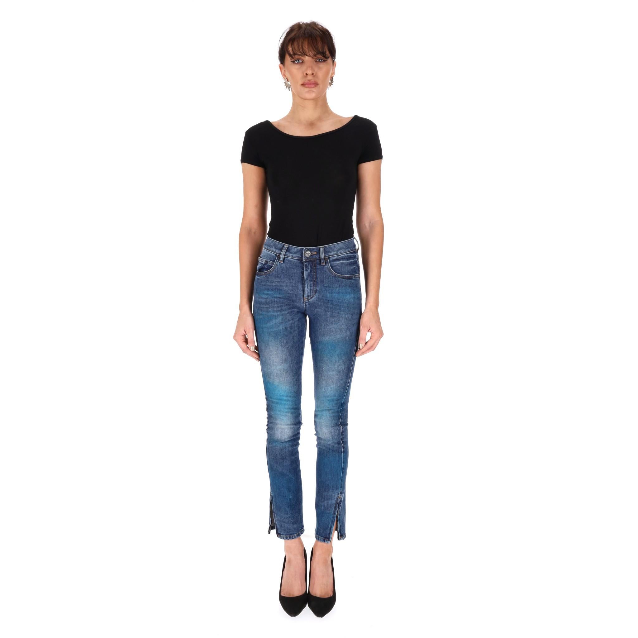 Rare Item - Chanel Cuba Collection Painted Cotton Jeans

From Resort 2017 Cuba Collection is this stylish blue denim with teal/green fading.

Embellished with black 'Coco Cuba' and 'CC' logo detailed button and studs.

'CC' logo zipper to the cuffs,