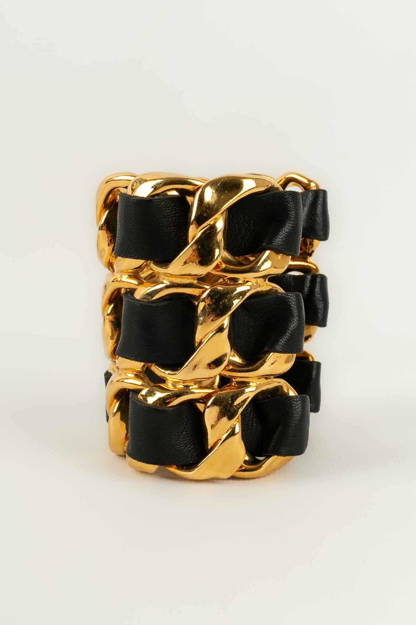 Women's Chanel Cuff Bracelet in Golden Metal and Black Leather For Sale