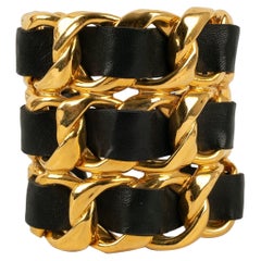 Chanel Cuff Bracelet in Golden Metal and Black Leather