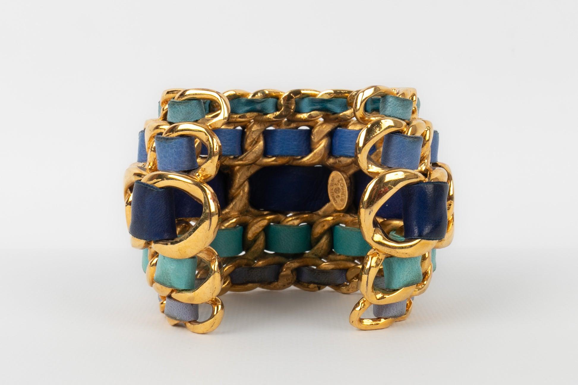 Women's Chanel Cuff Bracelet in Golden Metal Interlaced with Blue Tone Leather, 1991 For Sale