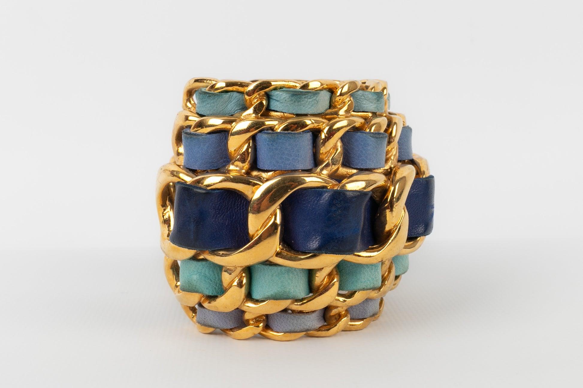 Chanel Cuff Bracelet in Golden Metal Interlaced with Blue Tone Leather, 1991 For Sale 1