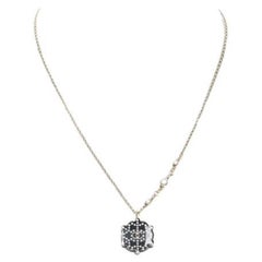 CHANEL D18 CC micro black snowflake acrylic triple pearl embellished necklace