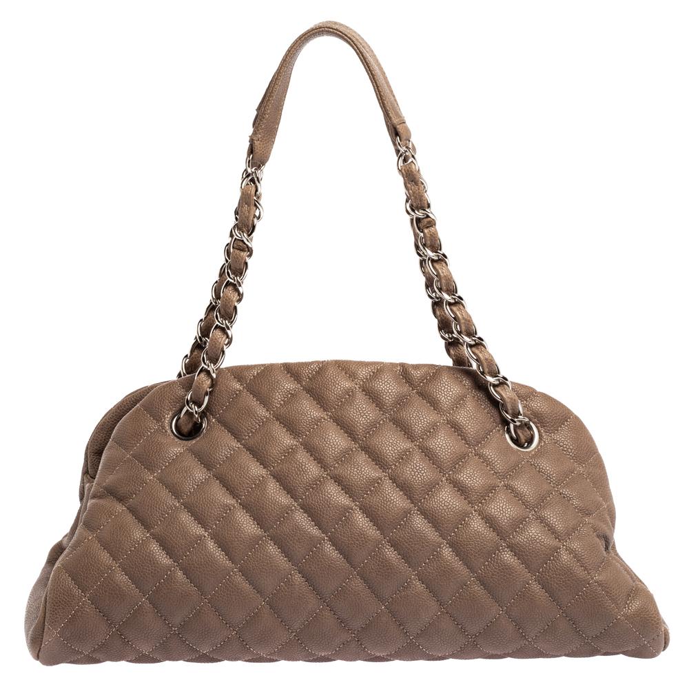 Spacious and captivating, this Just Mademoiselle Bowler bag is from Chanel. It has been crafted from quilted leather and features a lovely shape and design. It is equipped with two chain handles and well-sized fabric compartments to keep your