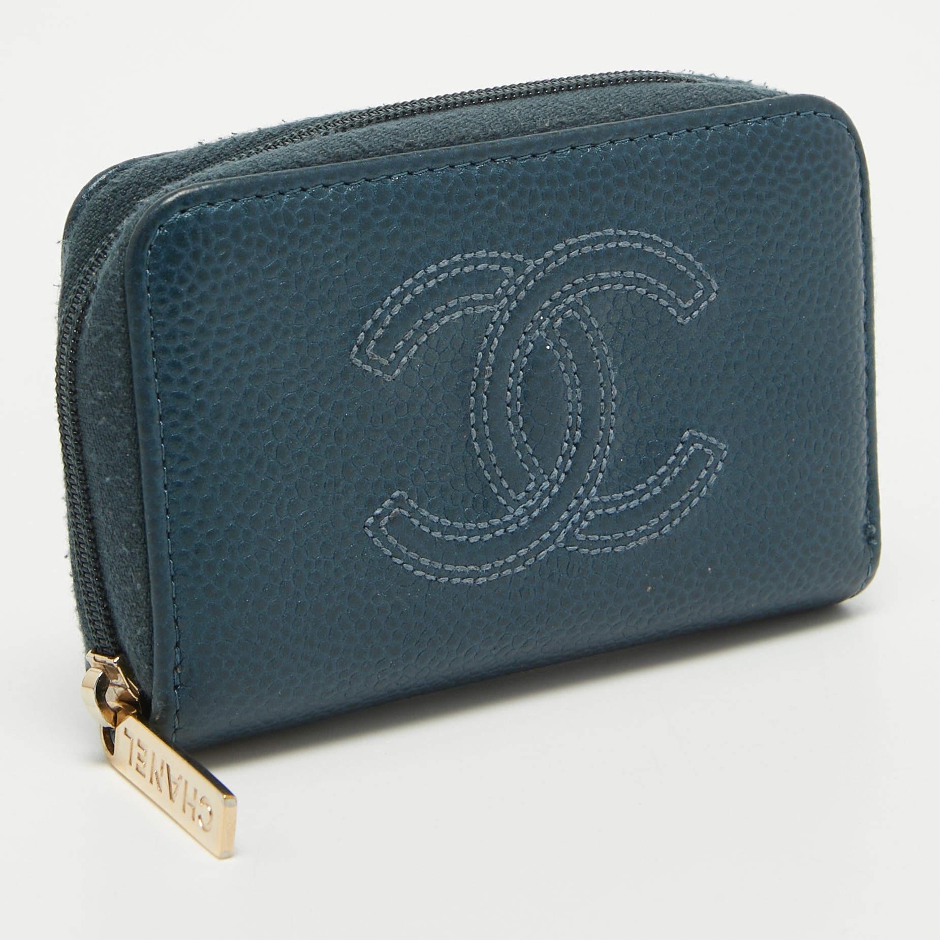 Crafted using Caviar leather, this Chanel coin purse will help carry your coins and other little essentials with ease. It comes in a lovely dark blue hue and is lined with fabric.

Includes
Original Dustbag, Authenticity Card
