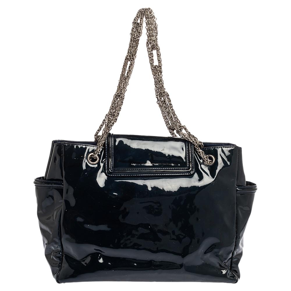 All of Chanel's designs are made with high attention to style and craftsmanship. This Reissue tote has been created with the same spirit from patent leather and strung by an interwoven chain link. The bag features a turn lock on the flap accented