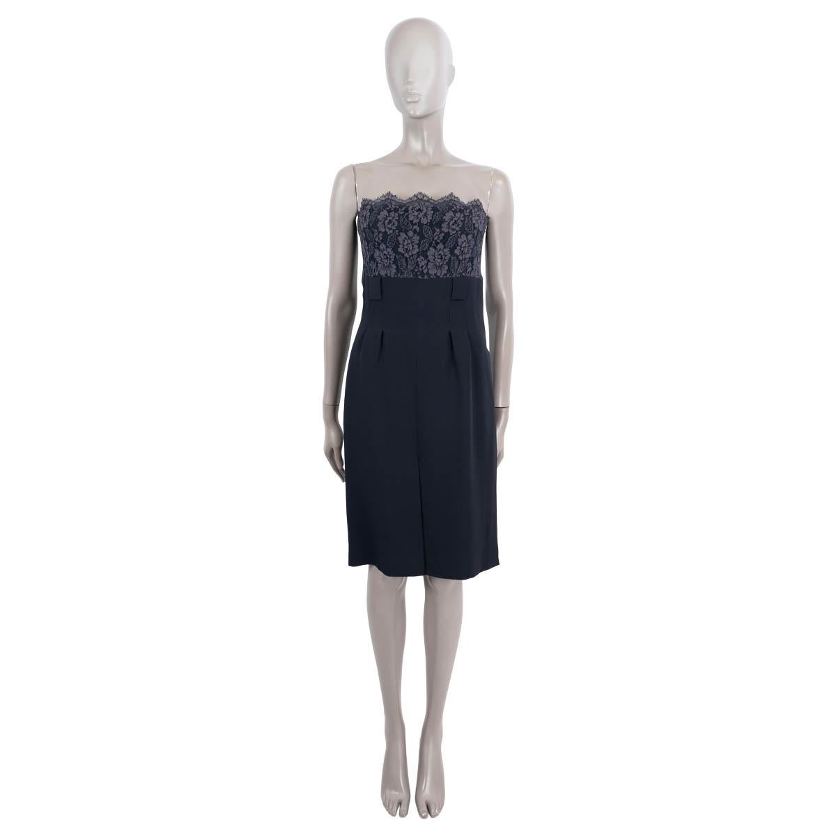 100% authentic Chanel cocktail dress in dark blue silk (100%) with top part in lace. Opens with zipper on the back. Lined. Belt around the waist is missing. Has been worn and is in excellent condition.

2007 Fall/Winter

Measurements
Model	07A