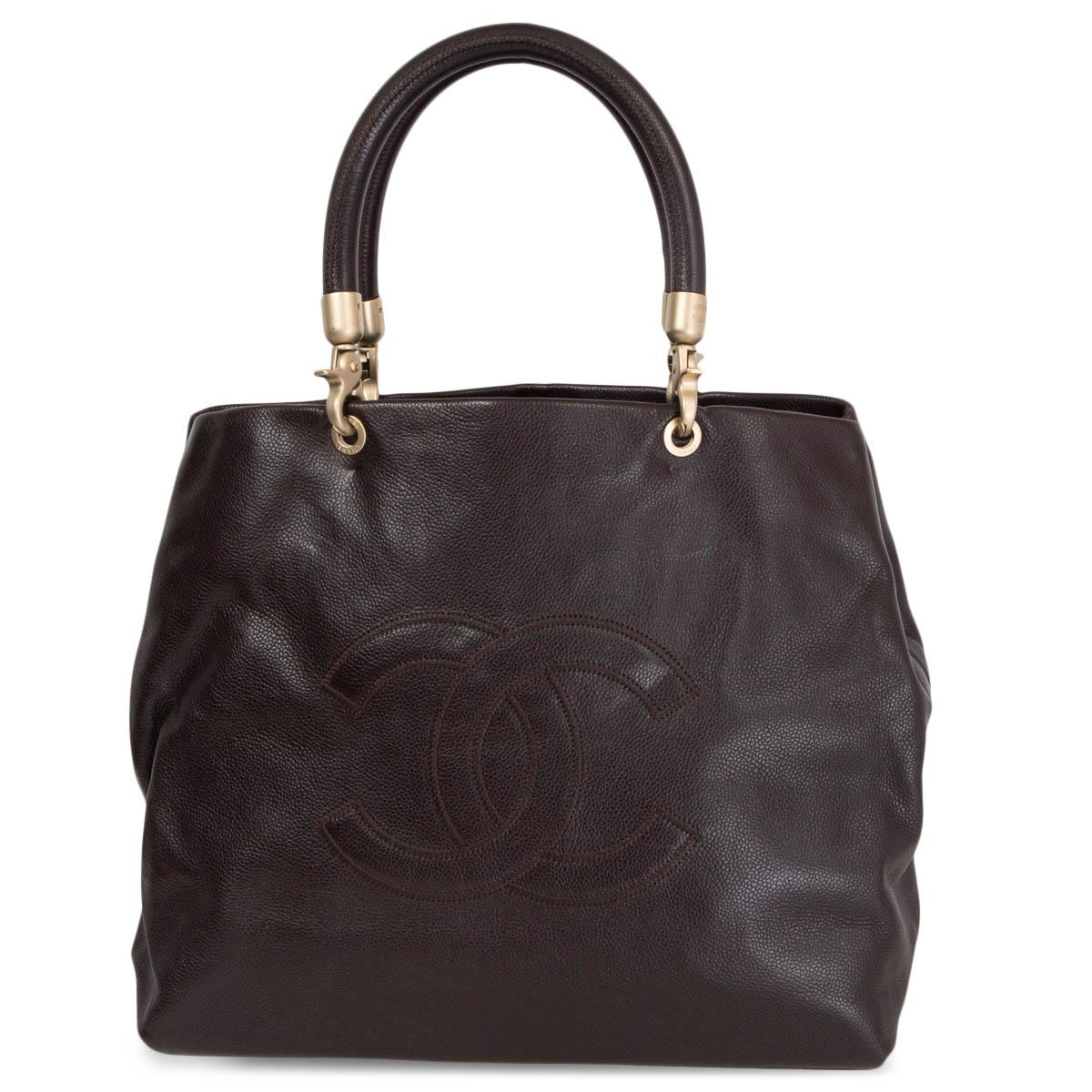 100% authentic Chanel vintage shoulder bag in espresso brown caviar leather with CC stitching at front featuring matte light gold-tone metal hardware. Lined in brown CC logo printed nylon with a big zip pocket in the middle and against the back. Has