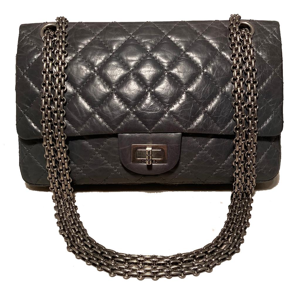 RESERVED FOR DELPHINE- DEPOSIT 
Chanel Dark Gray 2.55 Double Flap Classic 225 Reissue in excellent condition. Dark gray quilted aged calfskin exterior trimmed with ruthenium hardware and Bijoux shoulder strap. Front twist mademoiselle closure opens