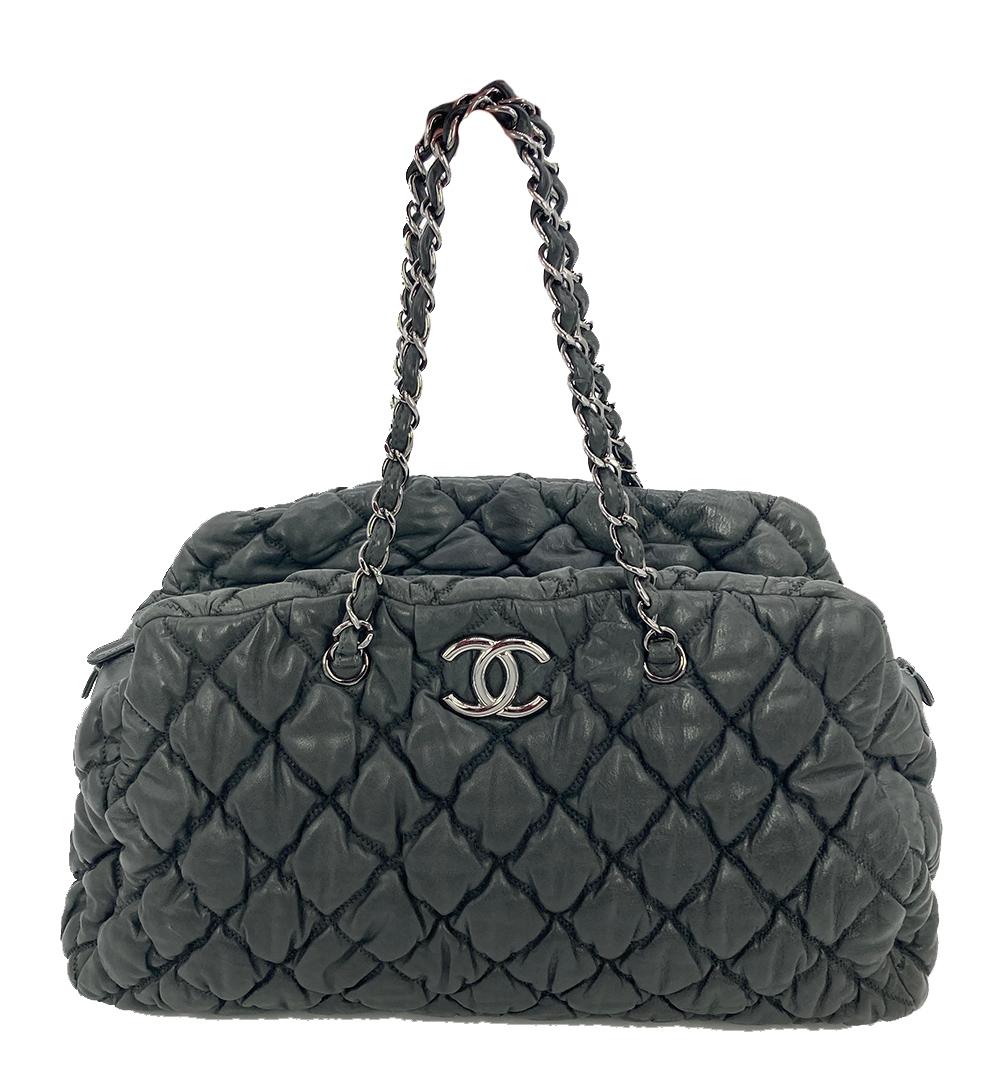 GORGEOUS Chanel puffy leather shoulder bag tote in excellent condition. quilted dark gray puffy leather exterior trimmed with silver hardware. Top zipper closure opens to a slate grey silk lined interior that holds 1 zipped and 2 slit side pockets.