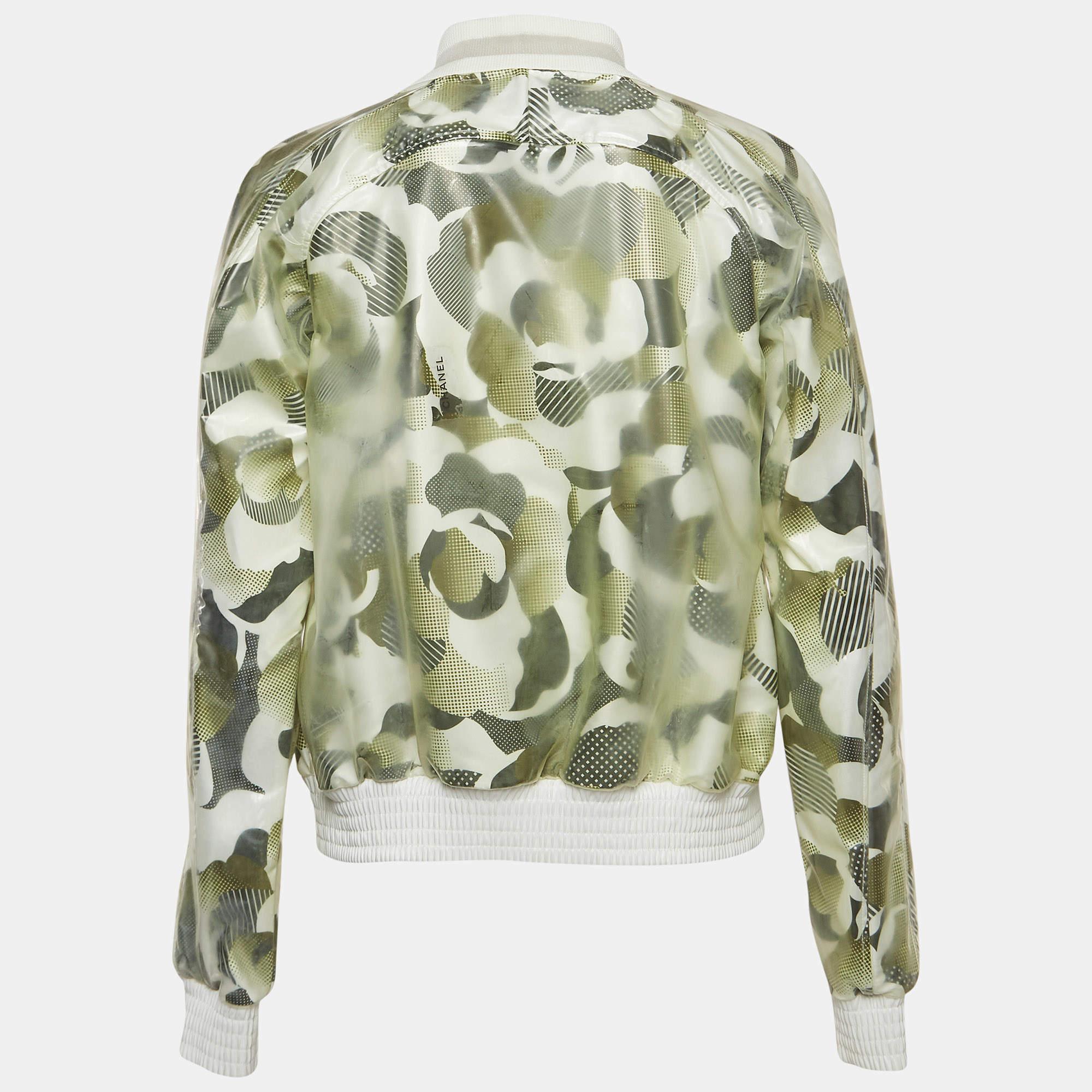 Step into sophistication with the Chanel bomber jacket. Crafted with meticulous detail, this piece boasts a rich dark green hue adorned with subtle prints, exuding elegance and modernity. The synthetic vinyl material ensures durability and a sleek