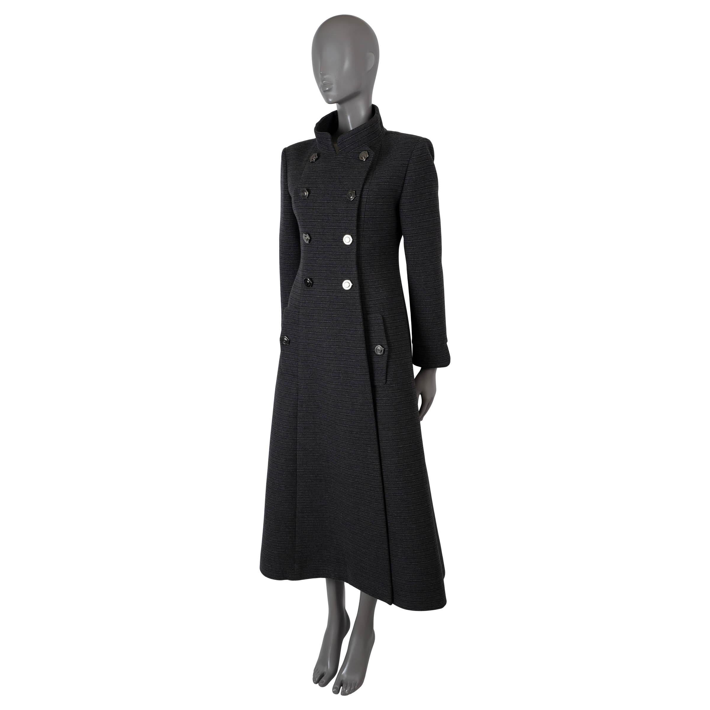 100% authentic Chanel midi coat in dark grey cashmere (74%) and wool (26%) with light grey fine stripes. Features a tailored silhouette, mock neck, two flap pockets at the waist and belt in the back. Opens with a double row of buttons and is lined