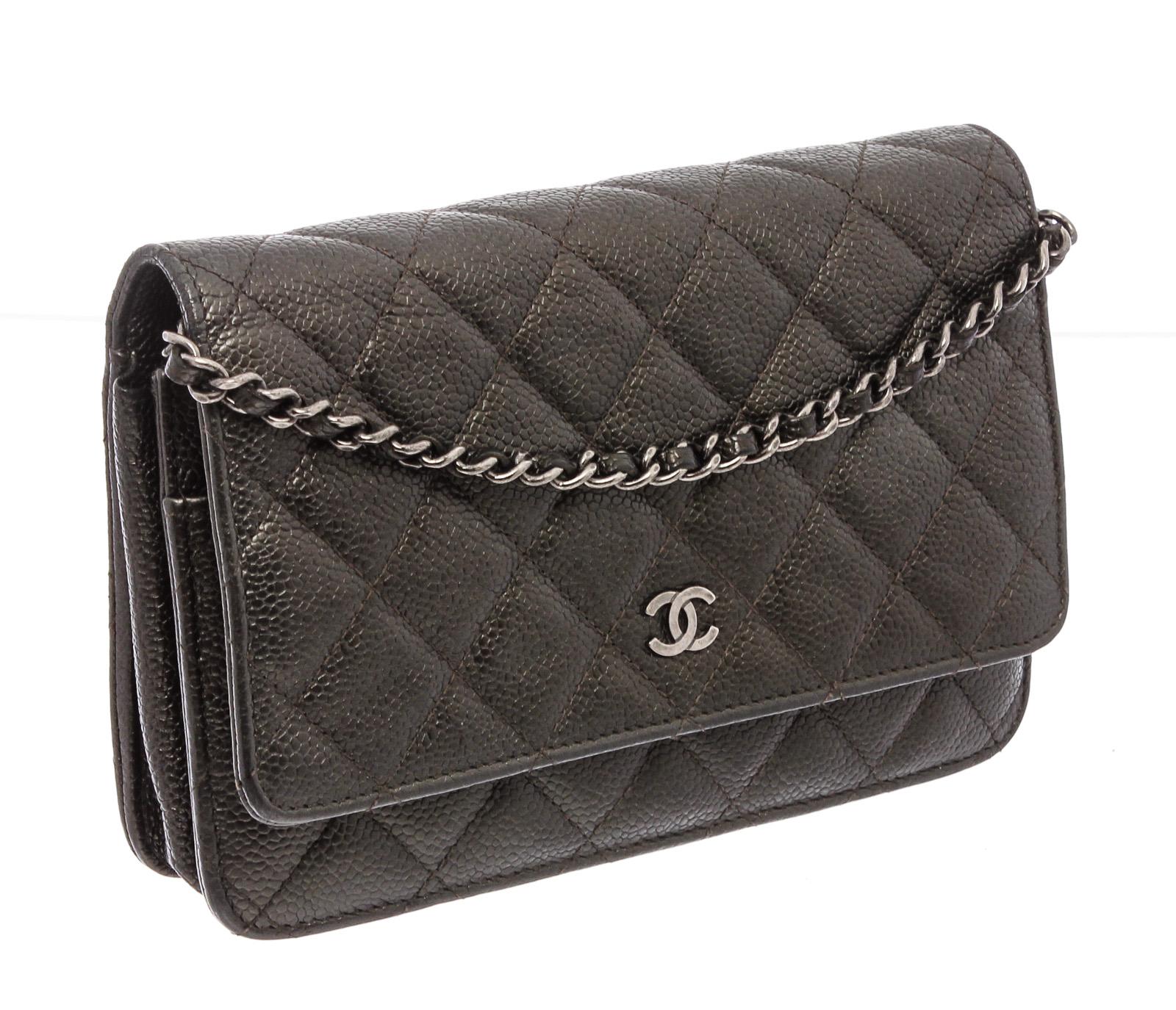 Dark grey quilted Caviar leather Chanel wallet on chain with silver-tone hardware, single chain-link and leather shoulder strap, interlocking 'CC' adornment at front flap, single patch pocket at back, dual pockets at front flap underside; one with
