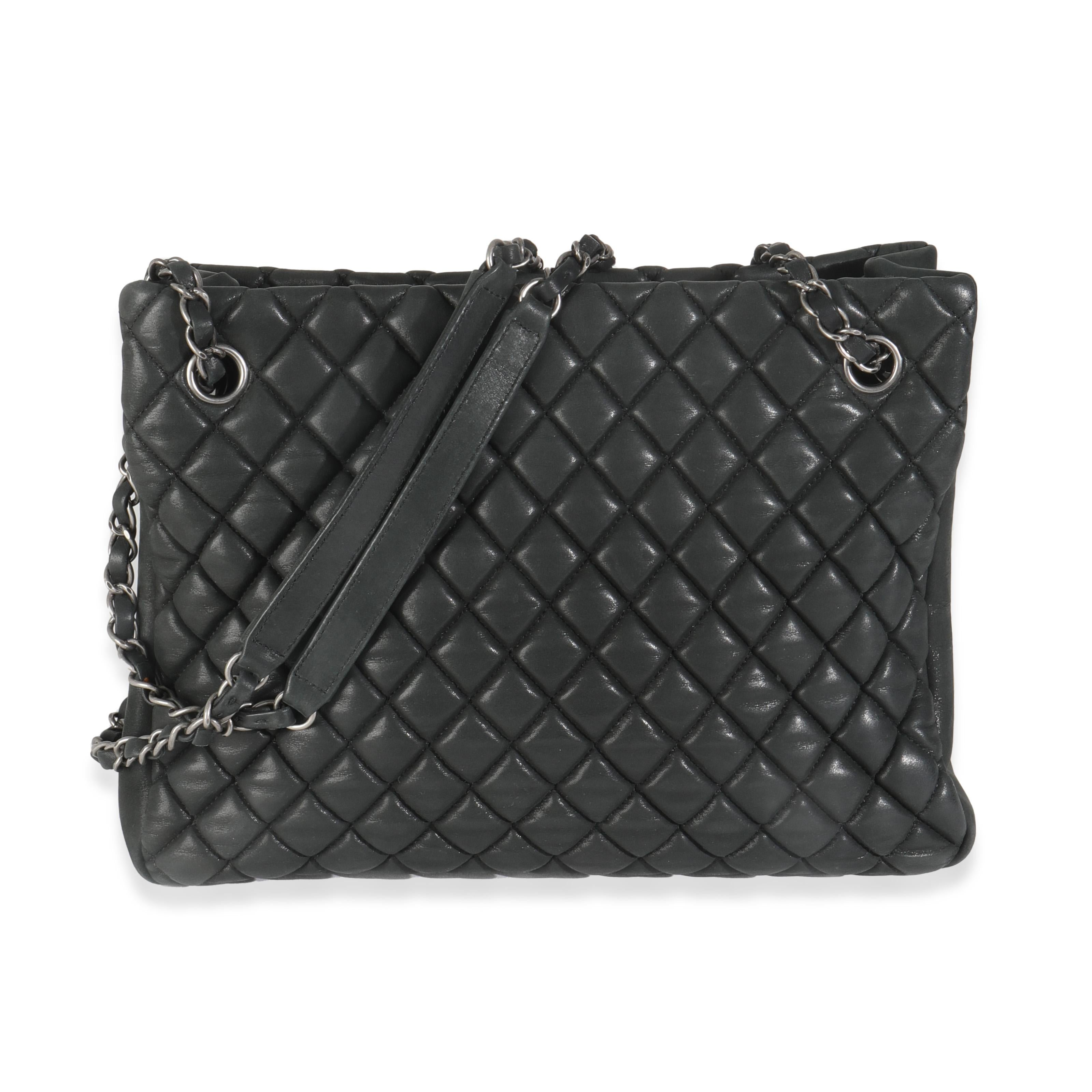 Listing Title: Chanel Dark Grey Iridescent Calfskin Small New Bubble Quilt Tote
SKU: 145062
Condition: Pre-owned 
Handbag Condition: Very Good
Condition Comments: Item is in very good condition with minor signs of wear.  Marks, scuffing and wear