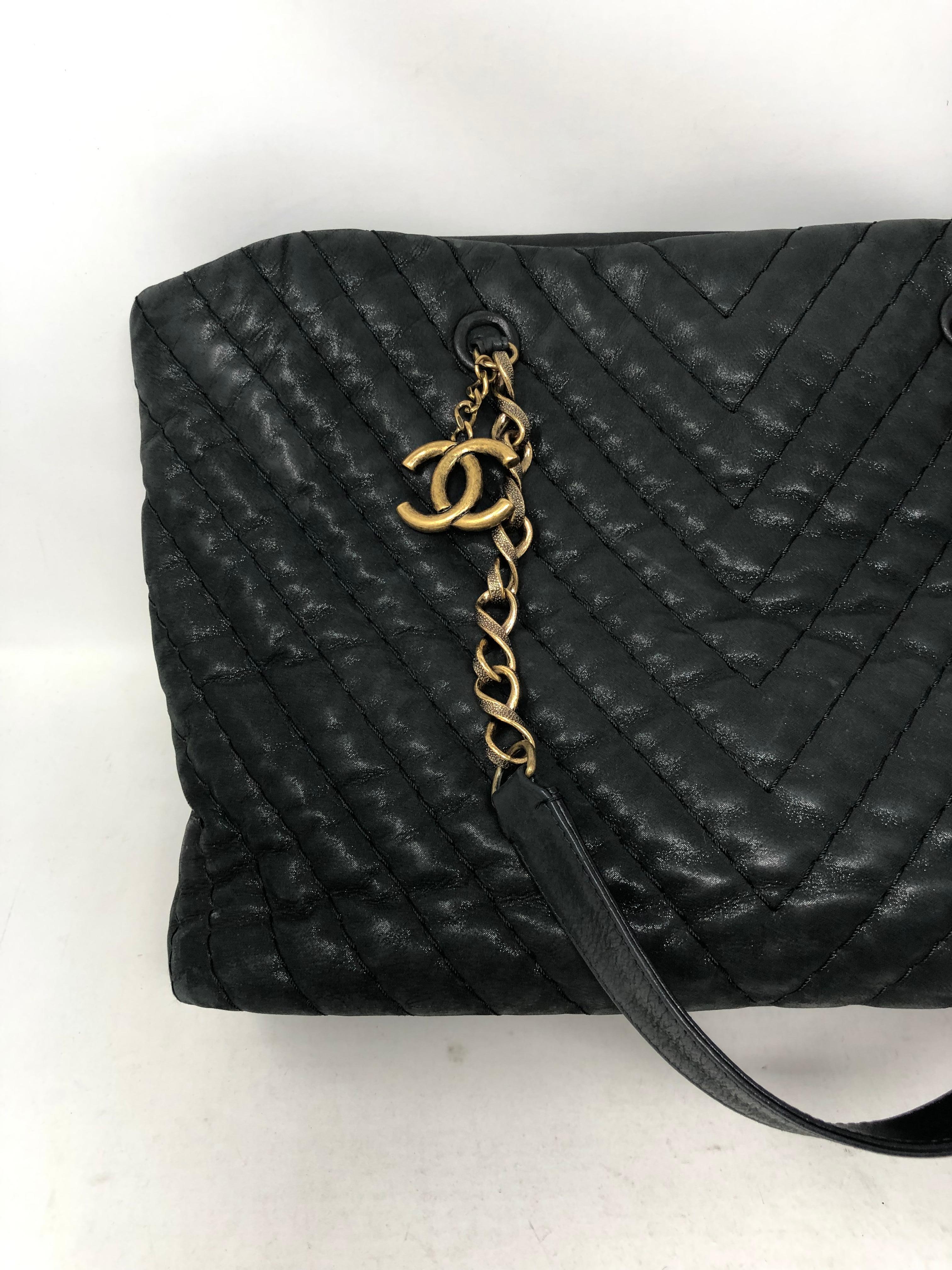 Chanel Dark Navy Tote with Antique Gold hardware. Chevron pattern leather tote. Mint like new condition. Burgundy interior. Includes Serial Card. Guaranteed authentic. 