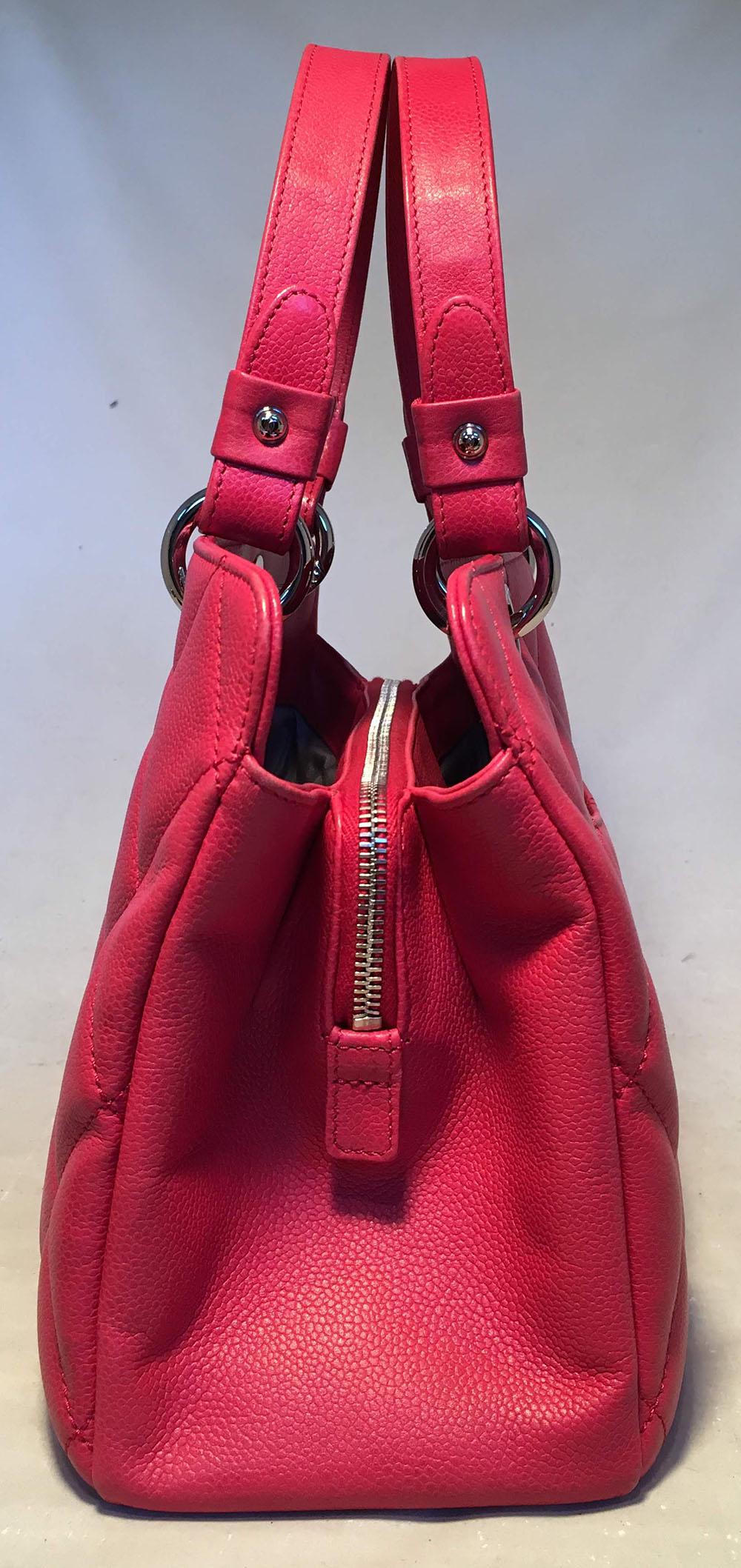 Chanel Dark Pink Caviar Quilted Grand Shopping Tote in excellent condition. Dark pink caviar quilted leather exterior trimmed with silver hardware. 3 separate interior storage compartments lined in grey nylon. Center zipped compartment. Back