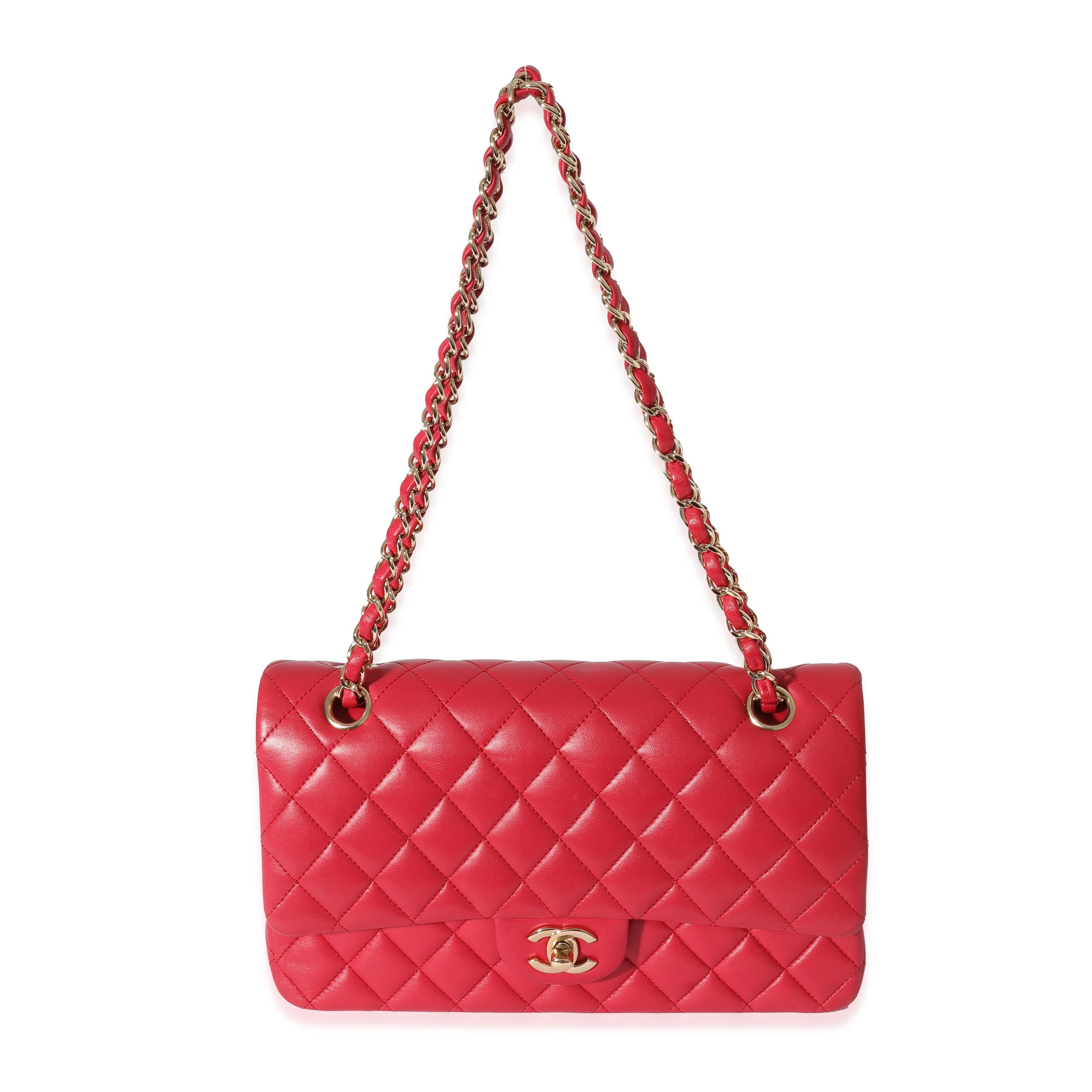 Listing Title: Chanel Dark Pink Lambskin Medium Flap Bag
SKU: 129039
Condition: Pre-owned 
Handbag Condition: Very Good
Condition Comments: Very Good Condition. Exterior corner scuffing and throughout.  Light discoloration. Heavy scratching at