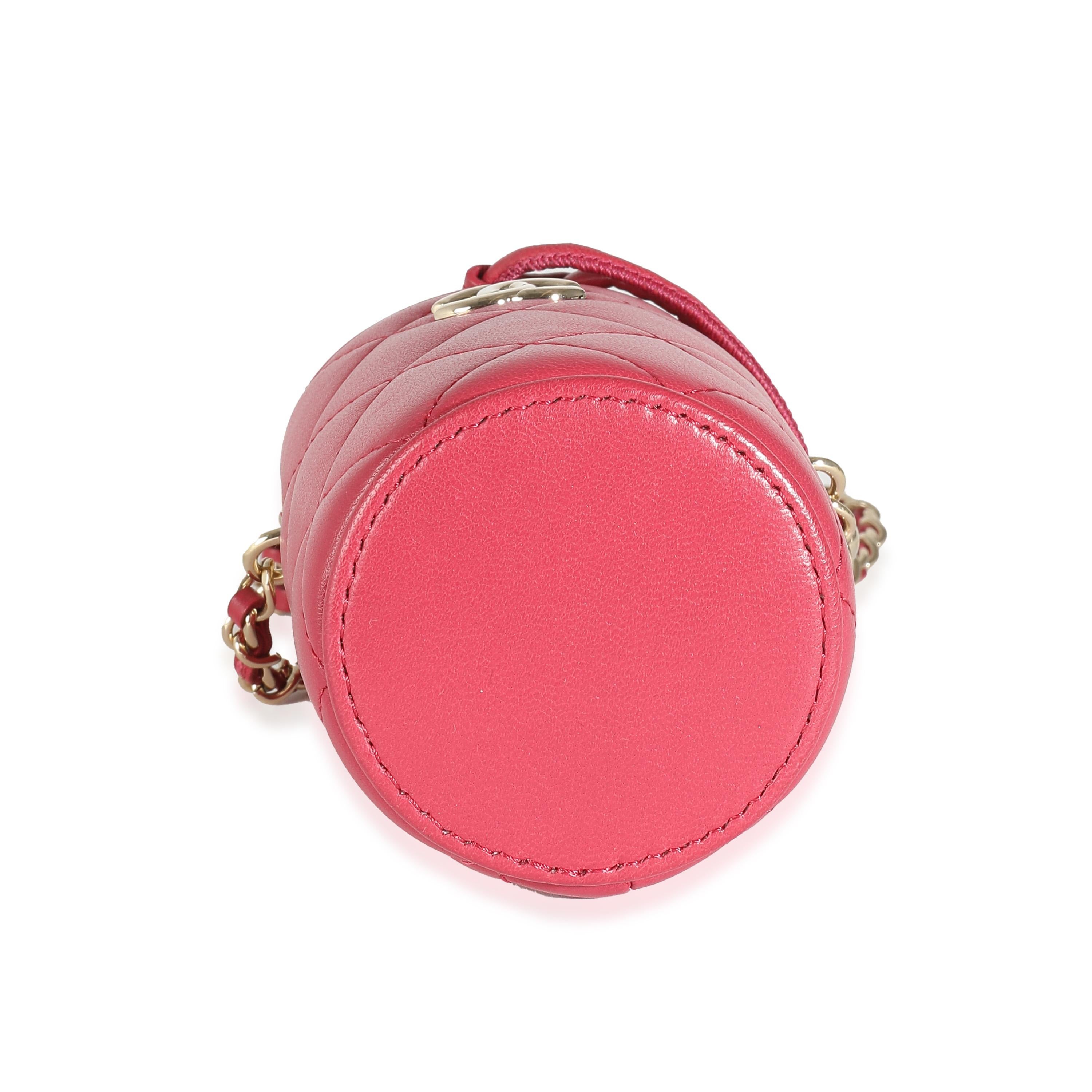 Listing Title: Chanel Dark Pink Quilted Lambskin Micro Drawstring Bucket
SKU: 138123
Condition: Pre-owned 
Handbag Condition: Excellent
Condition Comments: Item is in excellent condition and displays light signs of wear.
Brand: Chanel
Model: Micro