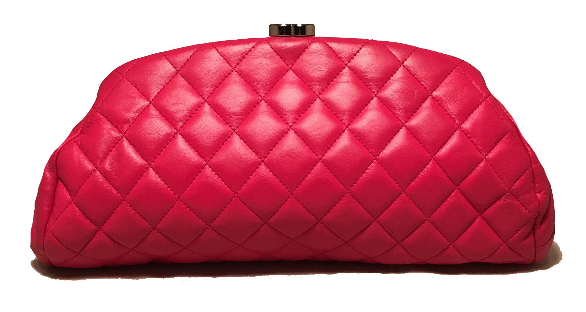 Chanel Dark Pink Quilted Leather Timeless Clutch in excellent condition. Dark pink quilted lambskin leather exterior. Lifting silver CC logo closure opens to a dark pink satin lined interior that holds one side zippered pocket. Overall excellent