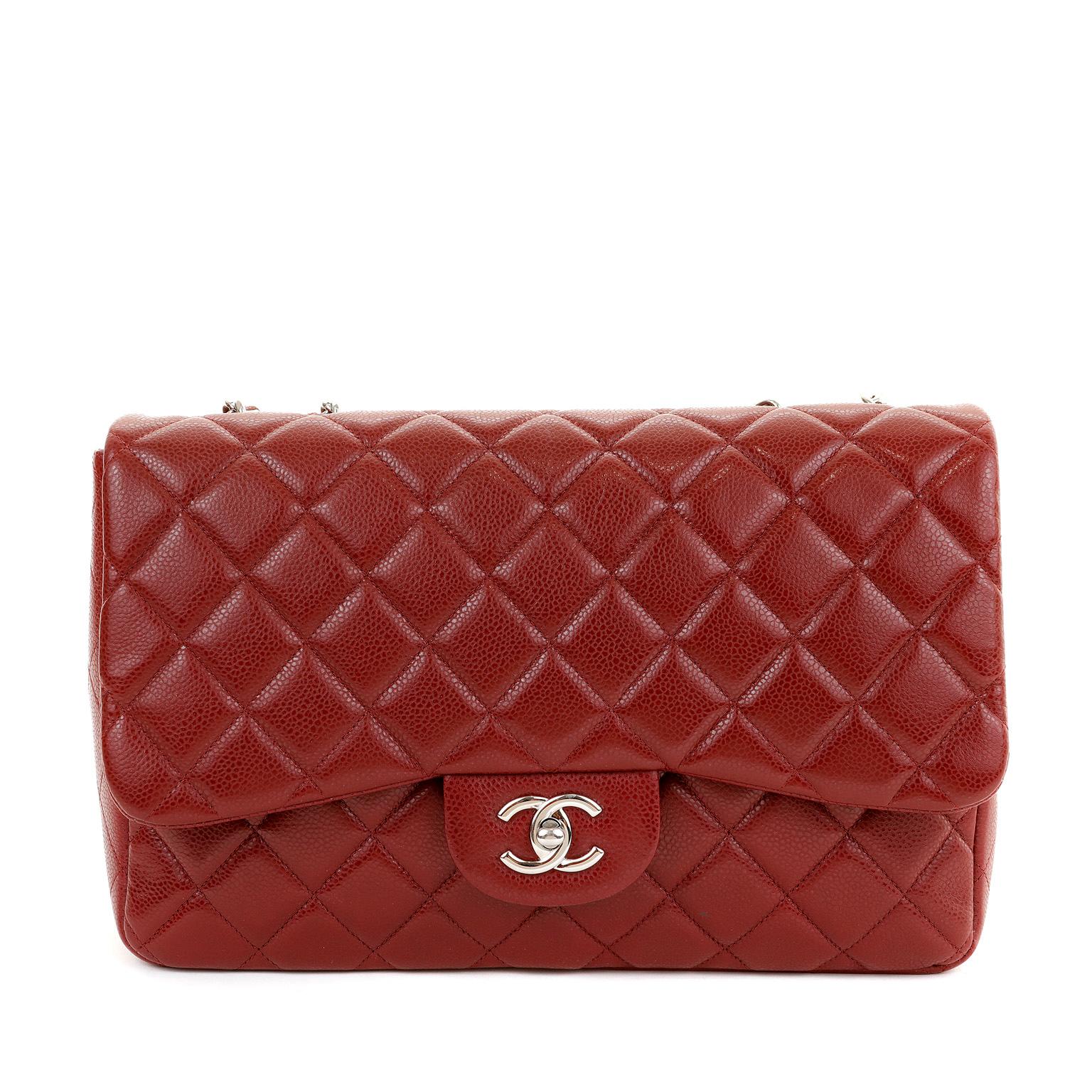 This authentic Chanel Dark Red Caviar Jumbo Classic Flap Bag is in pristine condition.  A key piece in any sophisticated wardrobe, the Classic Flap is one of the most sought-after Chanel styles produced.

Durable and textured deep red caviar leather