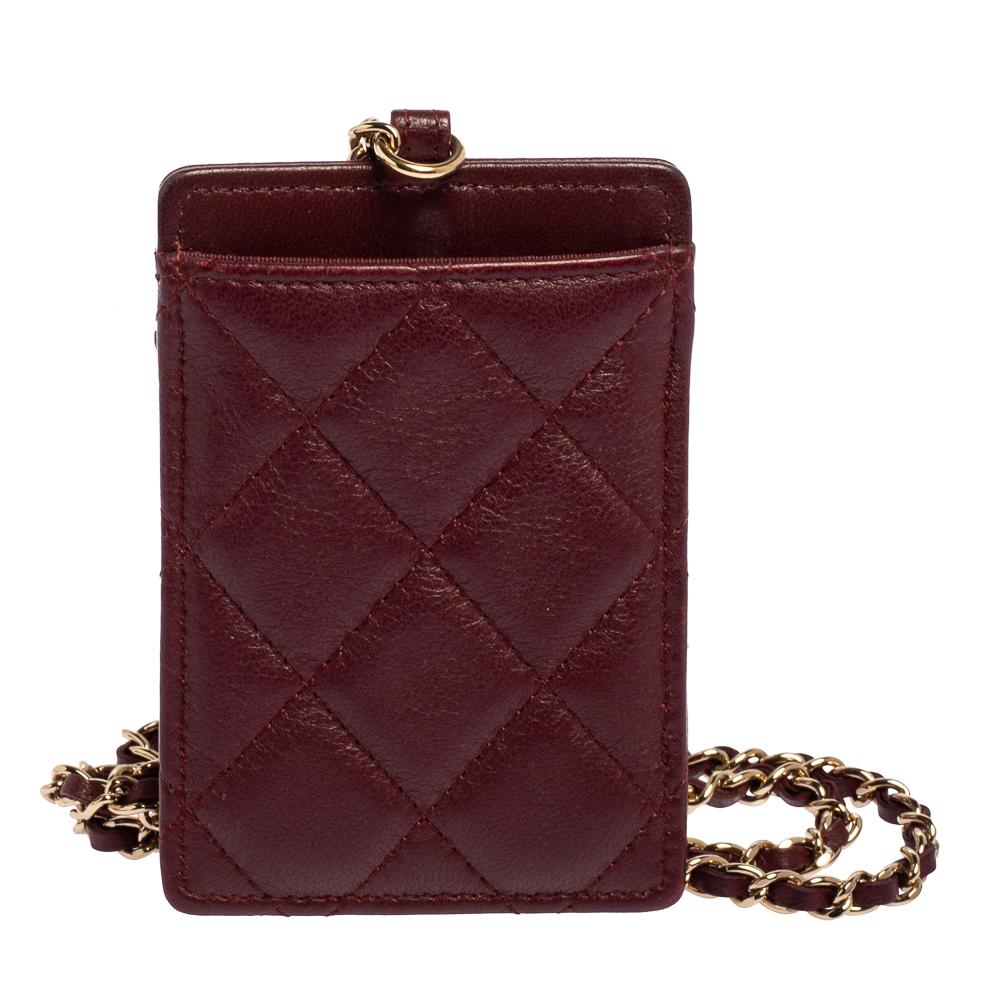 Not only functional but stylish too, this ID card holder from Chanel is worth buying! It has been crafted from dark red-hued leather and enhanced with gold-tone metal. It features a brand logo charm on the front and a chain strap.

Includes: