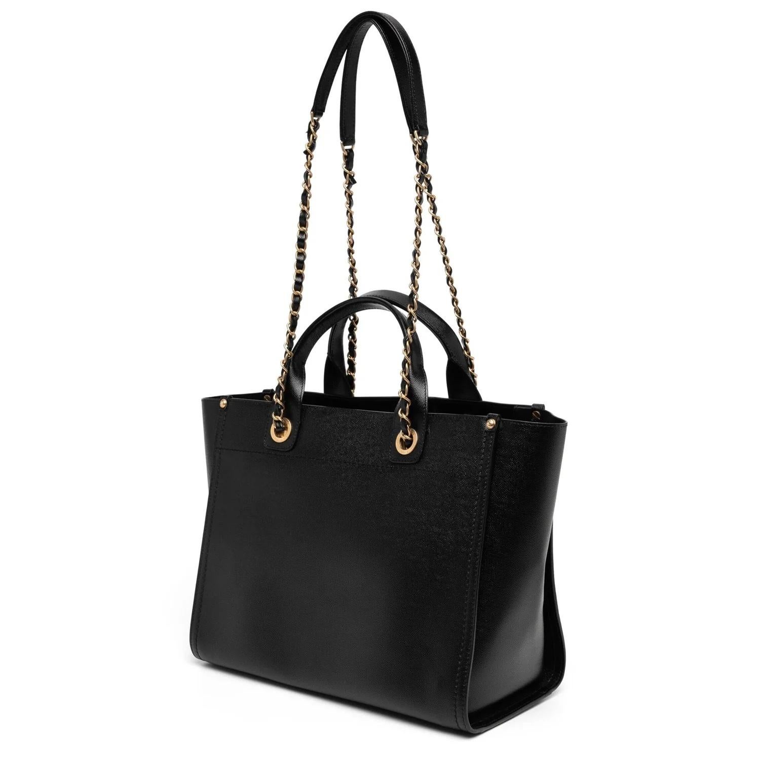 - Black
- Two top handles
- Gold-tone hardware
- Open top
- Main compartment
- Comes with dust bag
- Strap length 35cm / Handle length 12cm
- Condition: Excellent
This pre-loved bag is in excellent condition with minor signs of use.

Please kindly