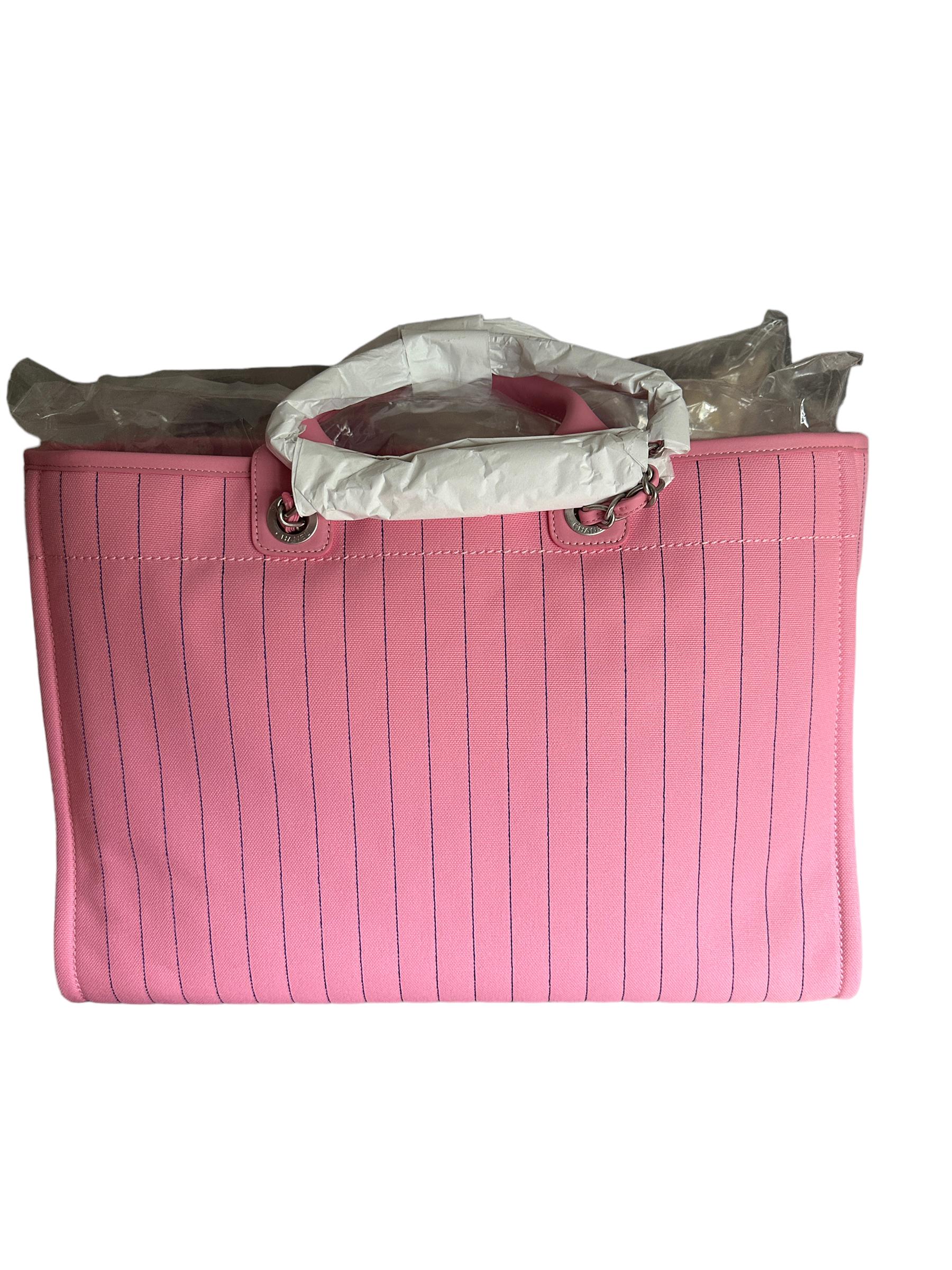 Extra Large SHOPPING TOTE
PINK Canvas
WITH BLUE FELT LETTERS
BRAND NEW
YOU GET IT JUST AS IF YOU PURCHASED FROM STORE
30CM
COMES WITH SEPARATE POUCHETTE 




 
The interior is lined with ecru fabric
zipper pocket on the rear wall. 
CHANEL CHARM