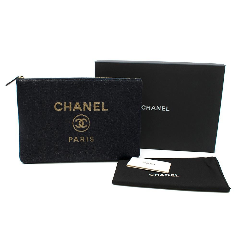 Chanel Deauville Denim O'Case 

-Deauville collection
-Blue denim
-Metallic gold Chanel logo 
-One pocket inside
-With authentication card, dust bag and box

Please note, these items are pre-owned and may show signs of being stored even when unworn